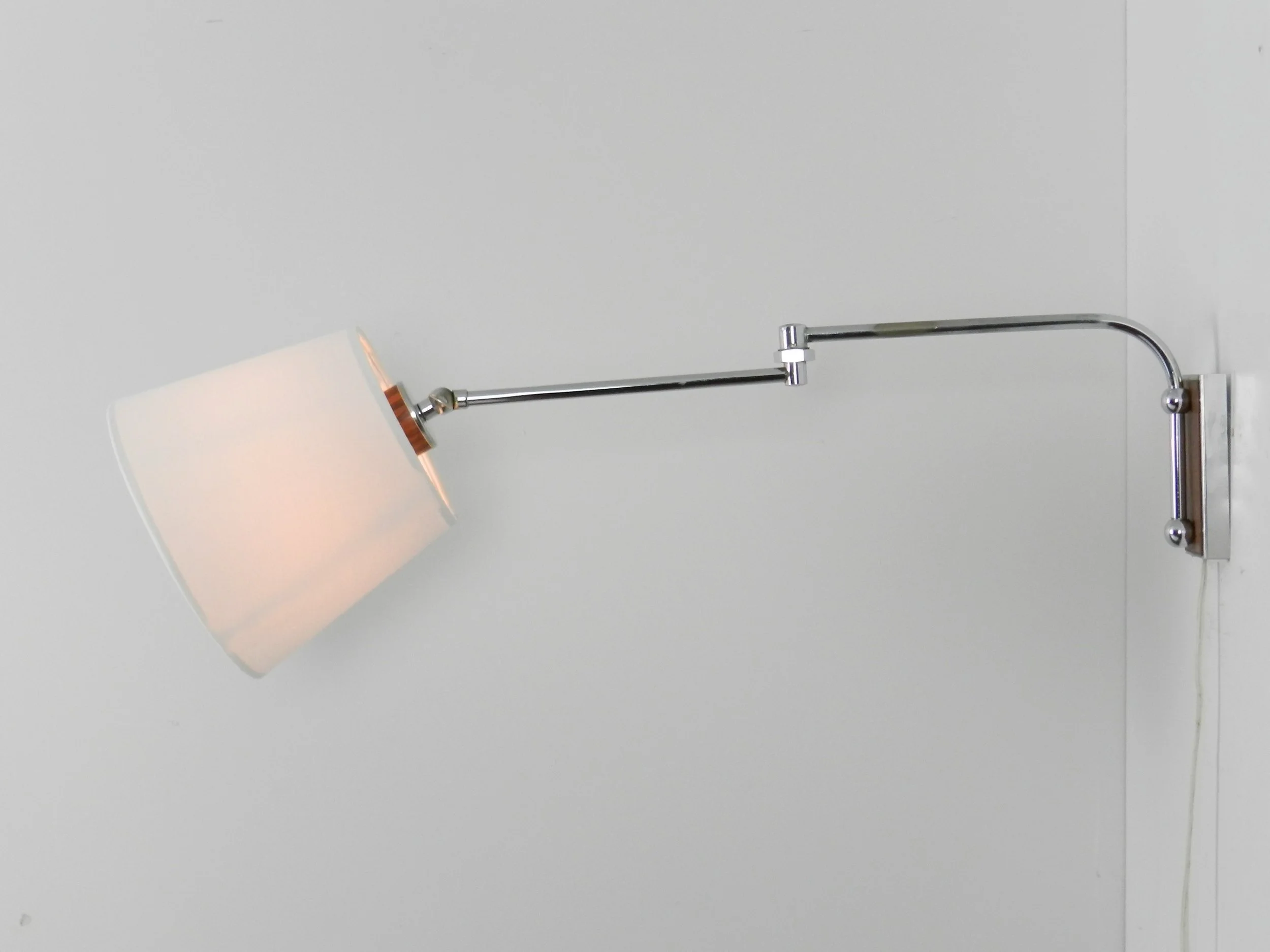Mid century articulating wall lamp in chrome with new shade.  Netherlands, 1970s.