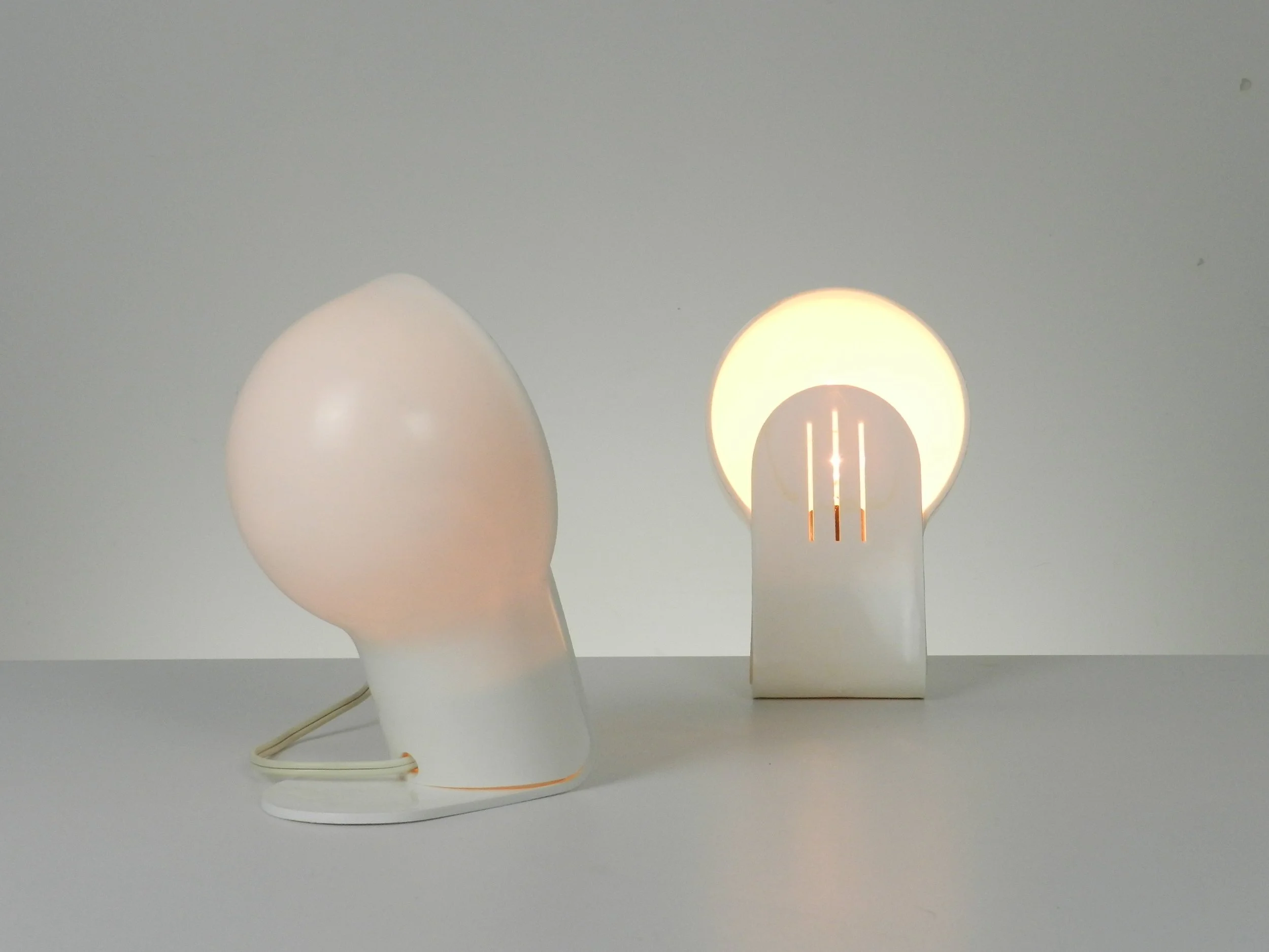 Pair of space age white plastic Panda lamps designed by Ambrogio Pozzi for Guzzini.  Italy, 1970s.