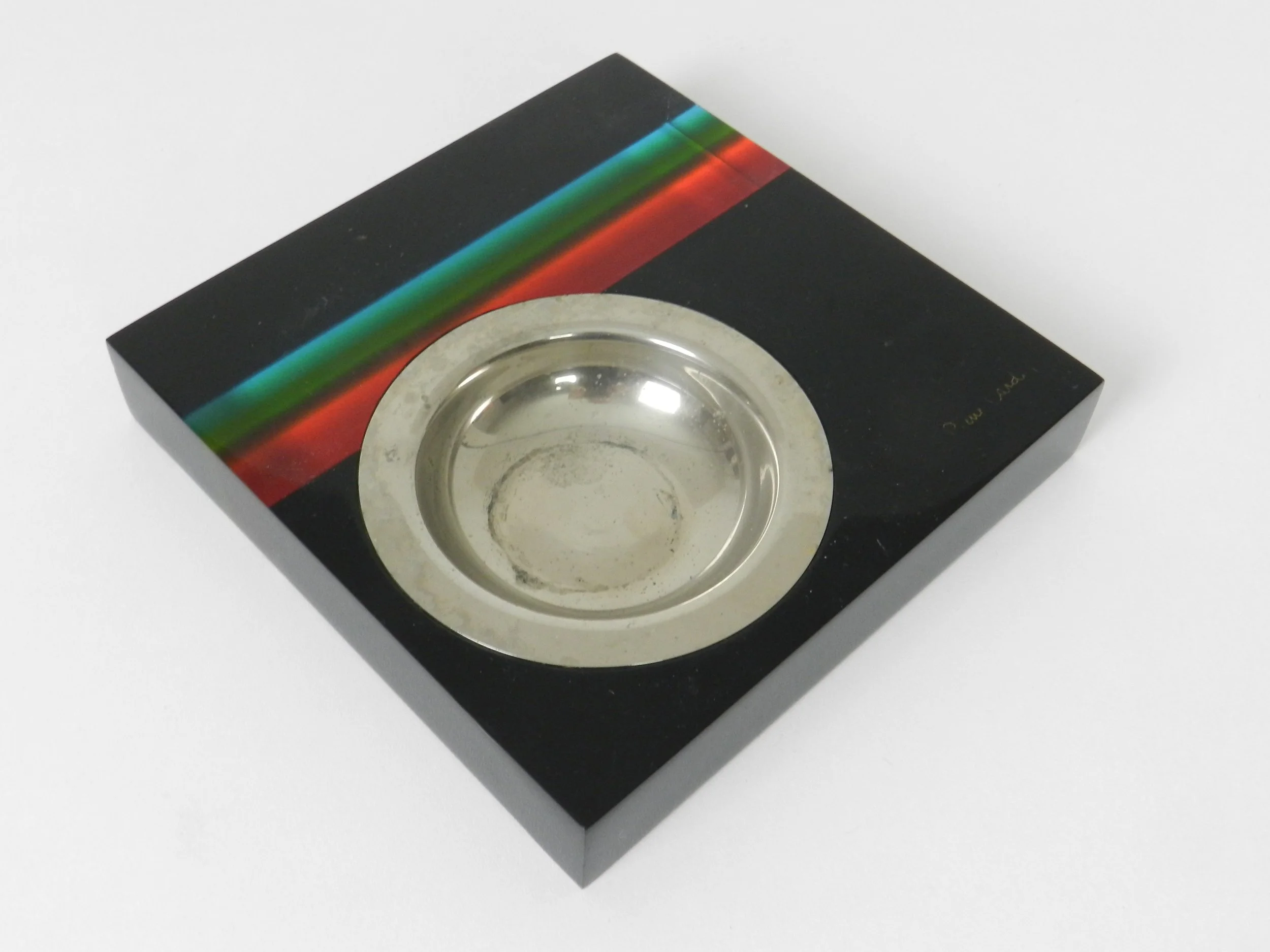Striped lucite ashtray with steel liner designed by Pierre Cardin.  circa 1970s.