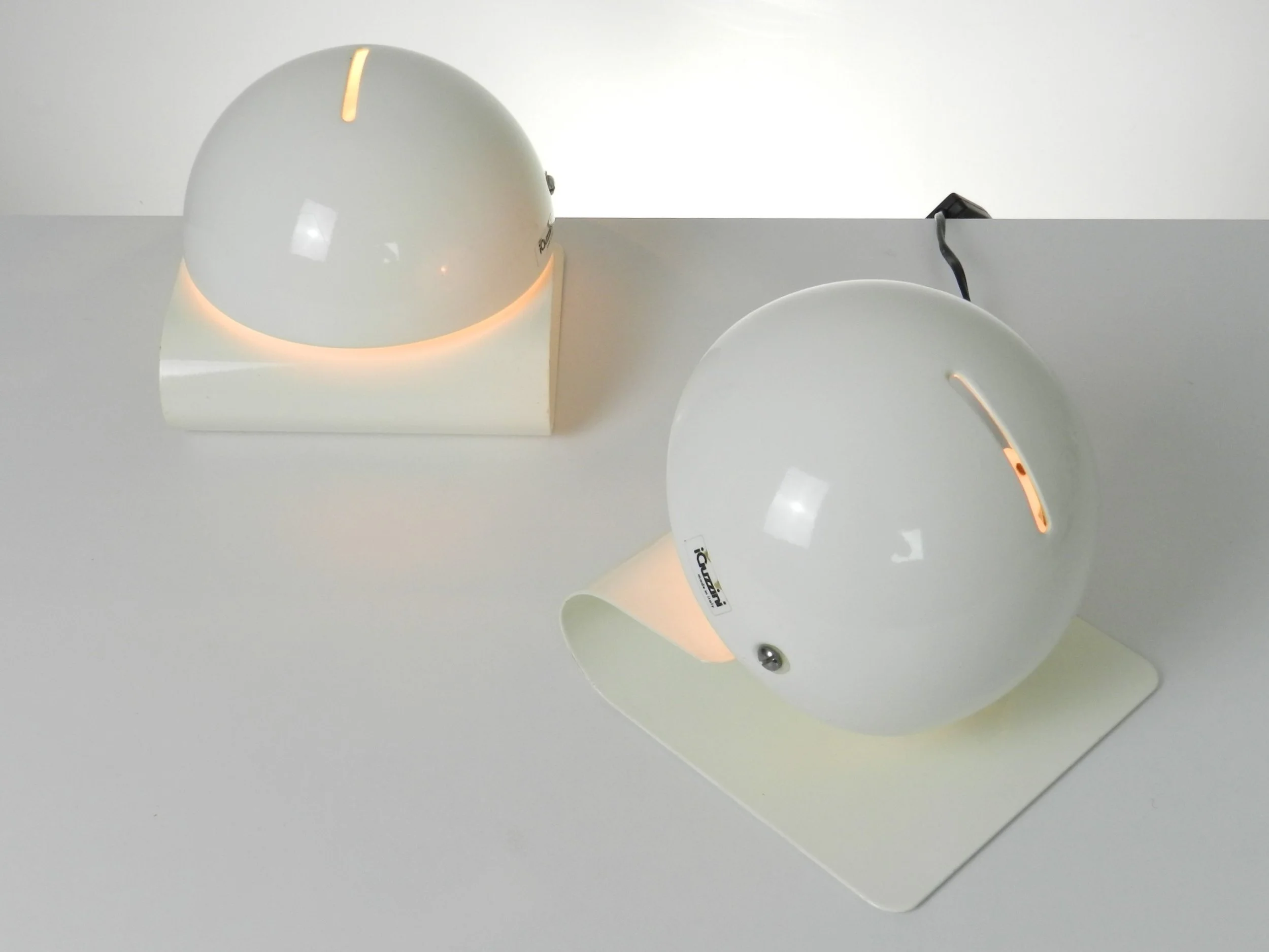 Pair of space age Bugia lamps designed by Giuseppe Cormio for Guzzini.  Italy, 1970s.