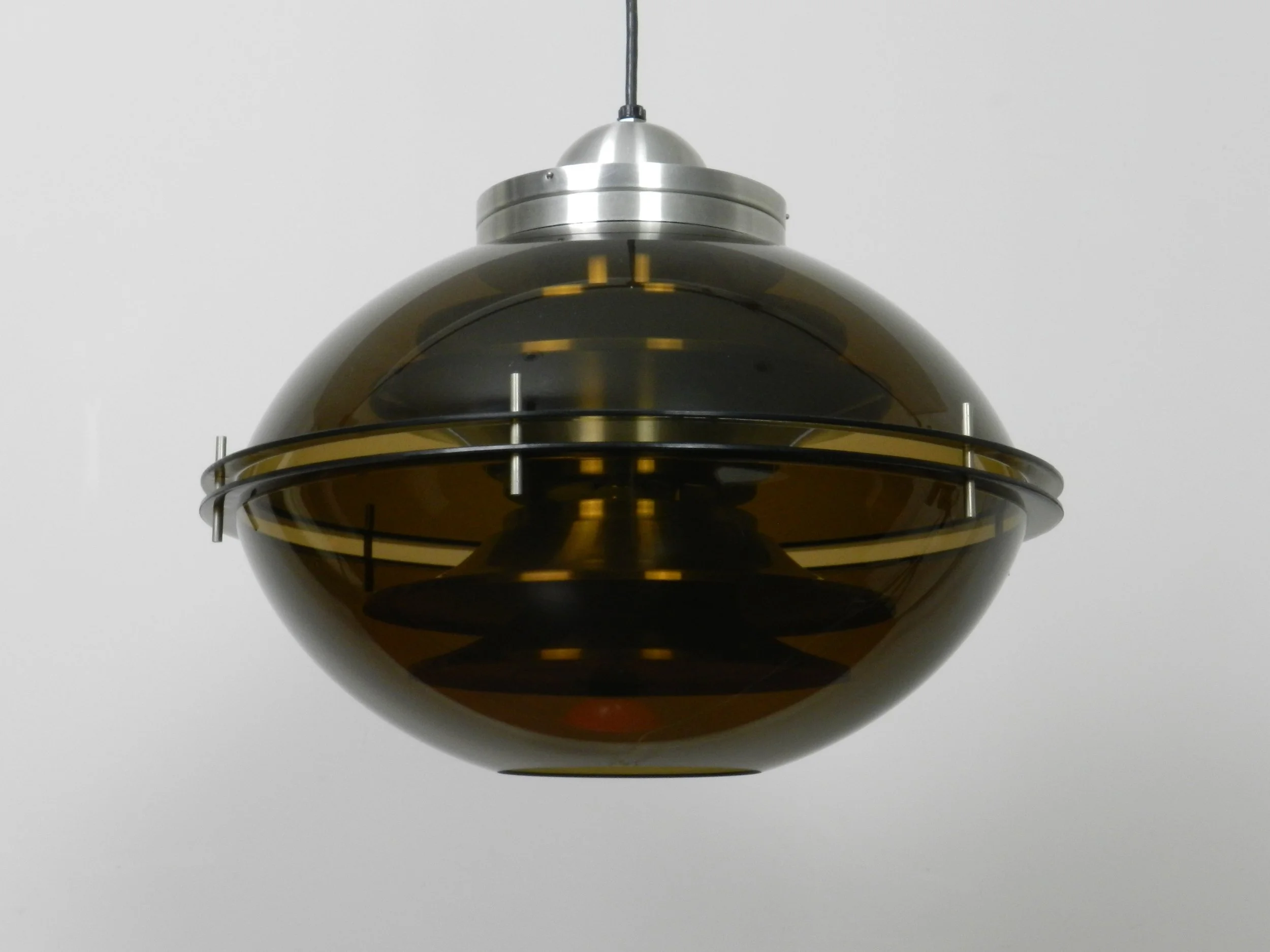 Space age pendant lamp with tinted acrylic outer shell and stacked aluminum plates on the interior by Herda.  Netherlands, 1970s.