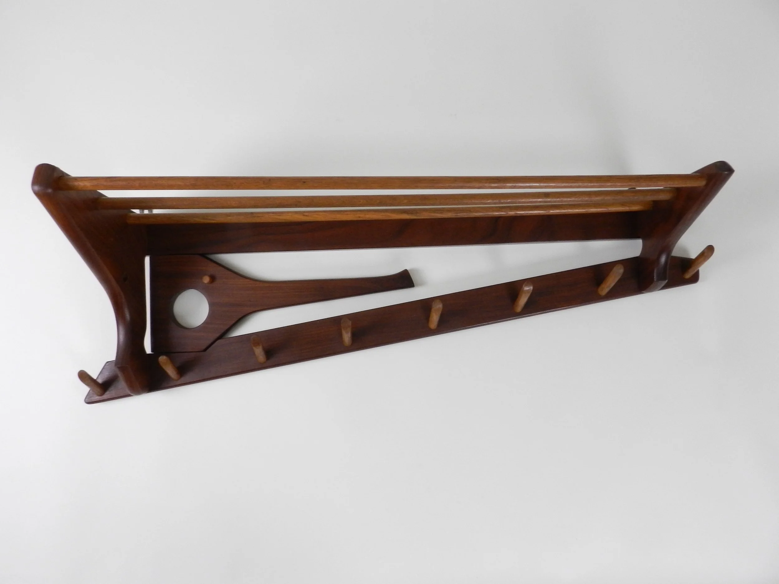 Vintage teak and oak wall mounted coat rack with swing out arm by Electrimeufa.  Netherlands, 1960s.