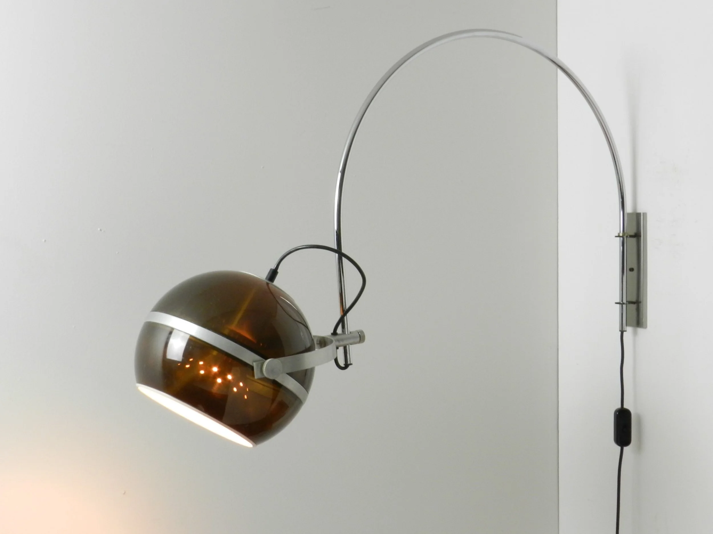 Modernist arc wall lamp in chrome plated steel amd tinted acylic by Dijkstra.  Netherlands, 1970s.