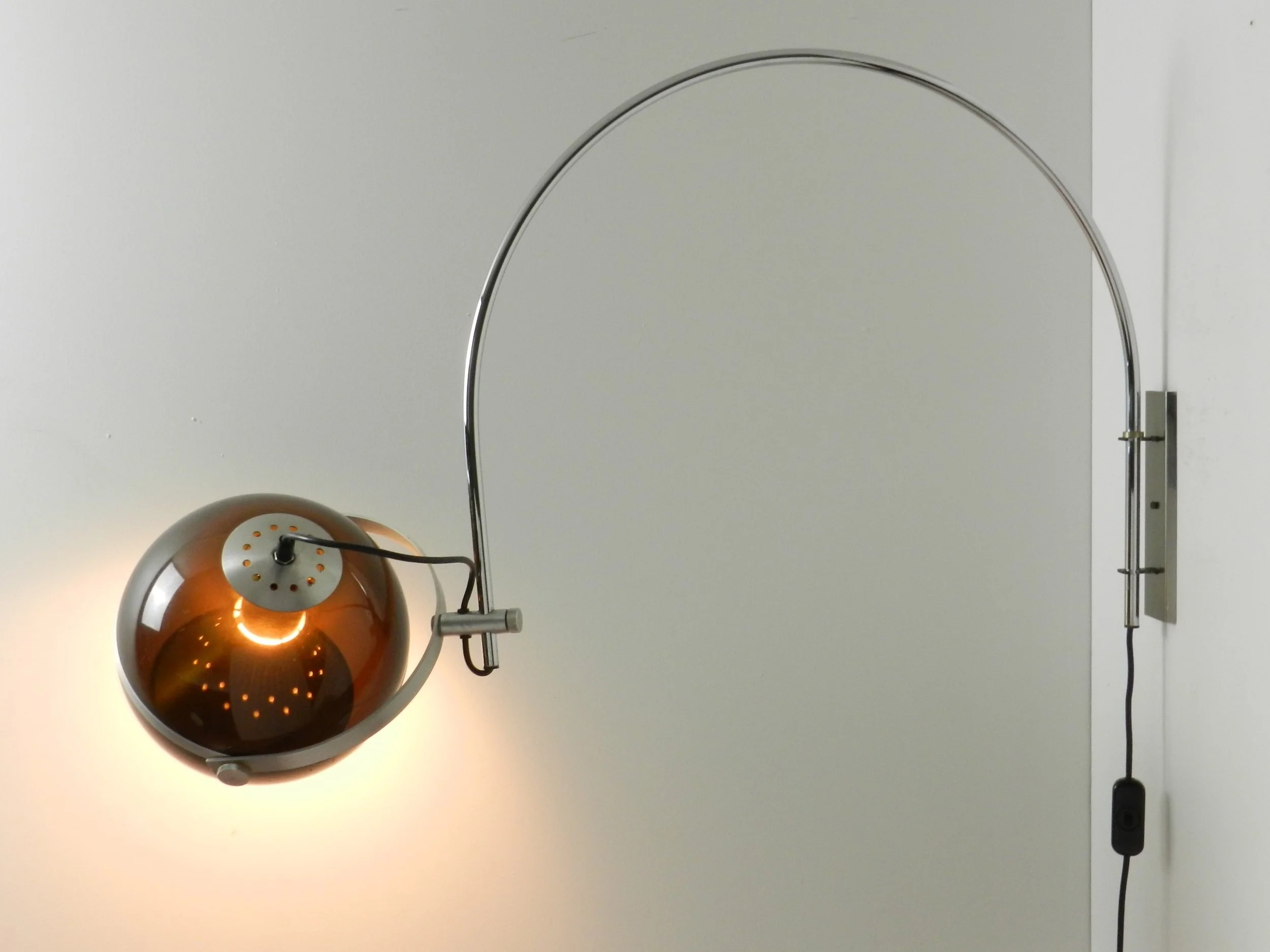 Modernist arc wall lamp in chrome plated steel amd tinted acylic by Dijkstra.  Netherlands, 1970s.