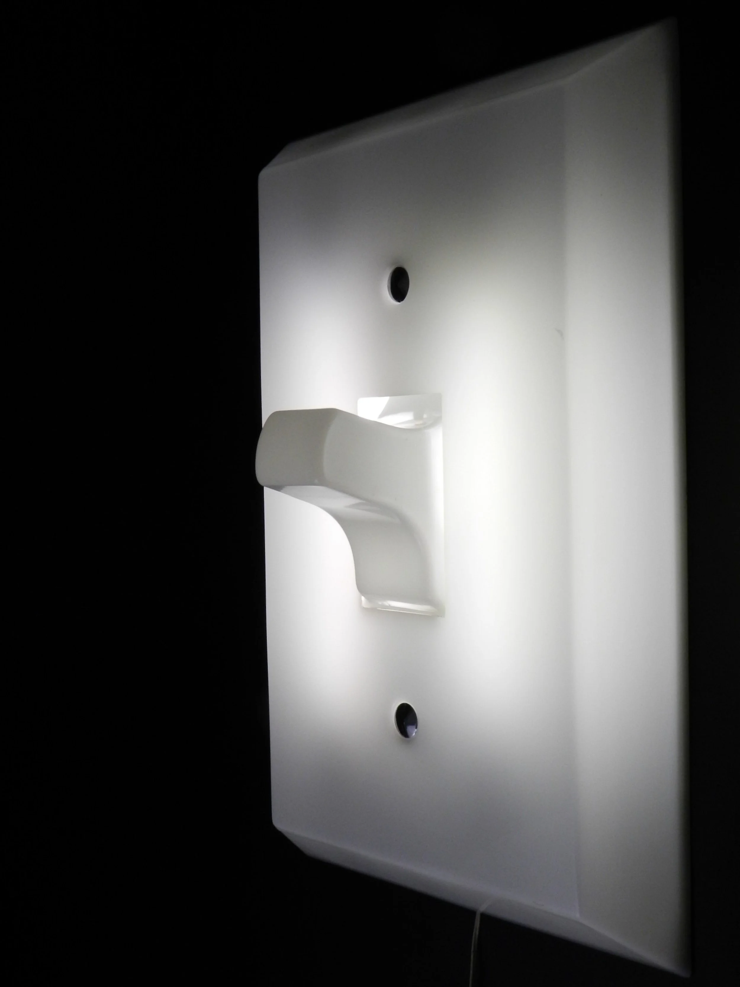 Vintage Think Big pop art light switch wall mount lamp in acrylic. Holds two flourescent tubes which is turned on by the light switch.  circa 1980s.