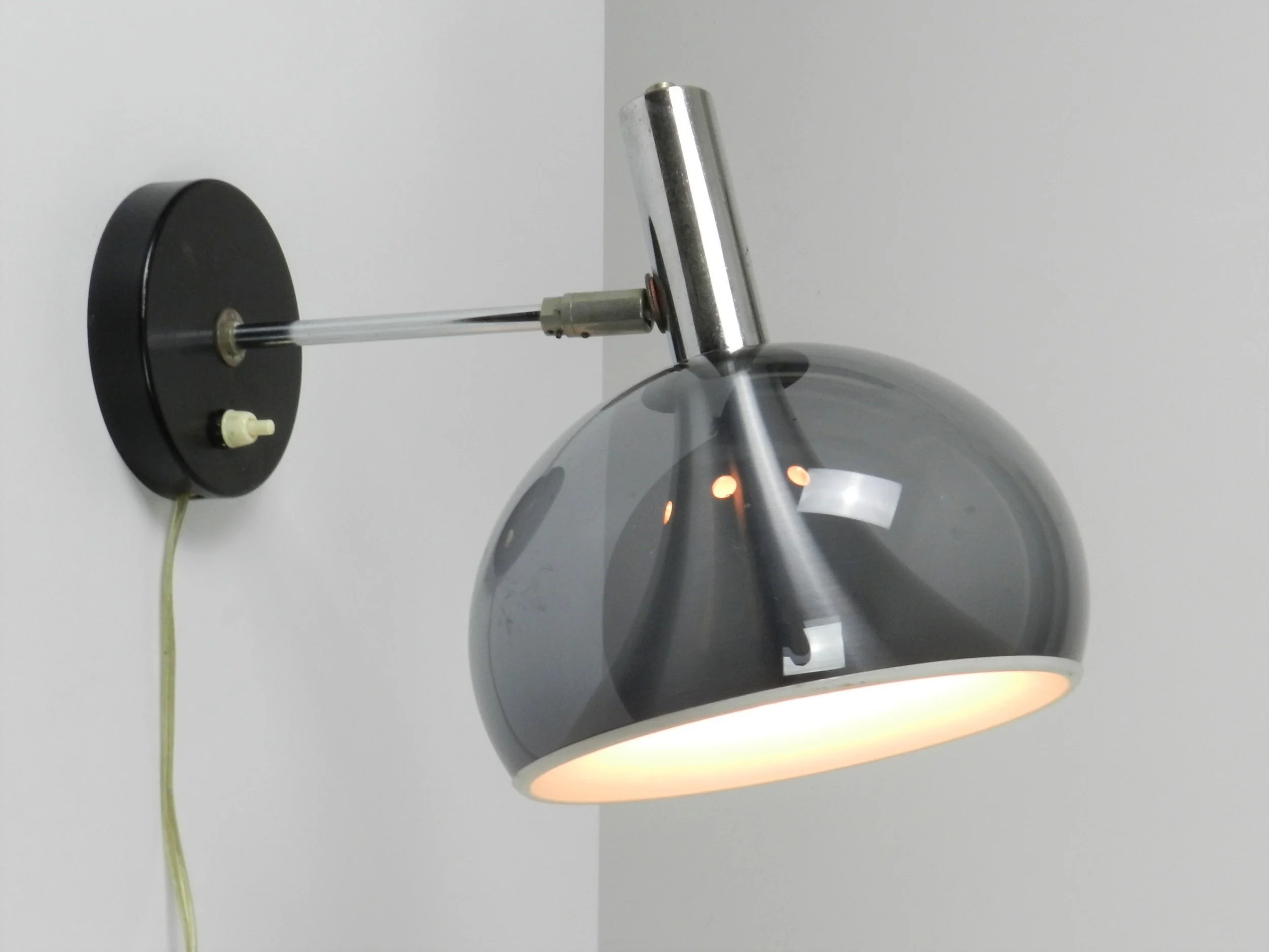 Space age wall lamp by Dijkstra. Chromed steel, aluminum and tinted acrylic.  Netherlands, 1970s.