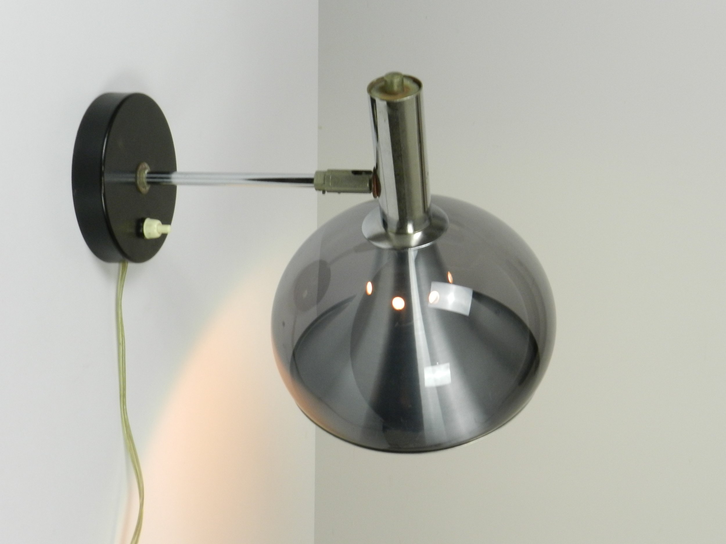 Space age wall lamp by Dijkstra. Chromed steel, aluminum and tinted acrylic.  Netherlands, 1970s.