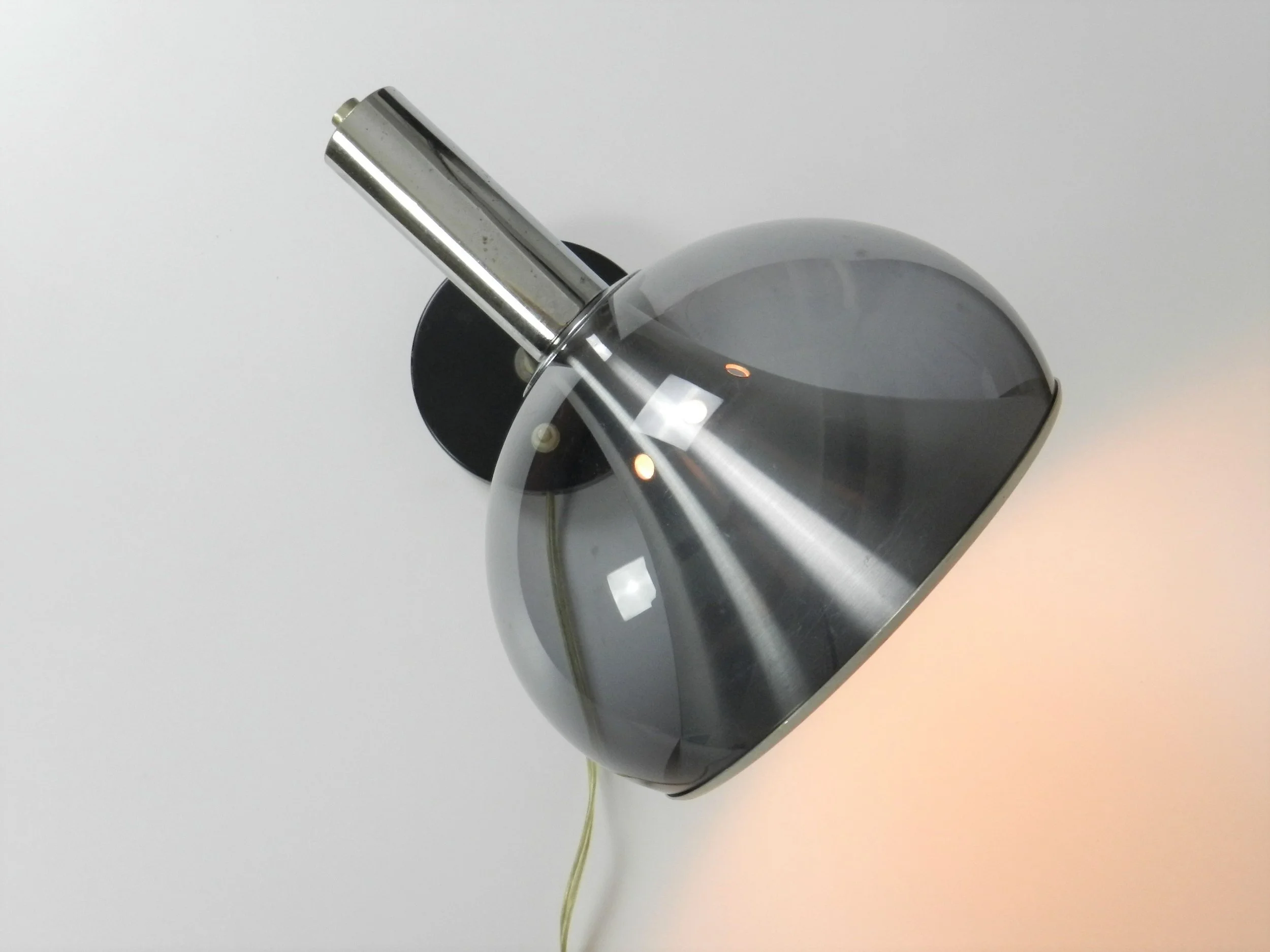 Space age wall lamp by Dijkstra. Chromed steel, aluminum and tinted acrylic.  Netherlands, 1970s.