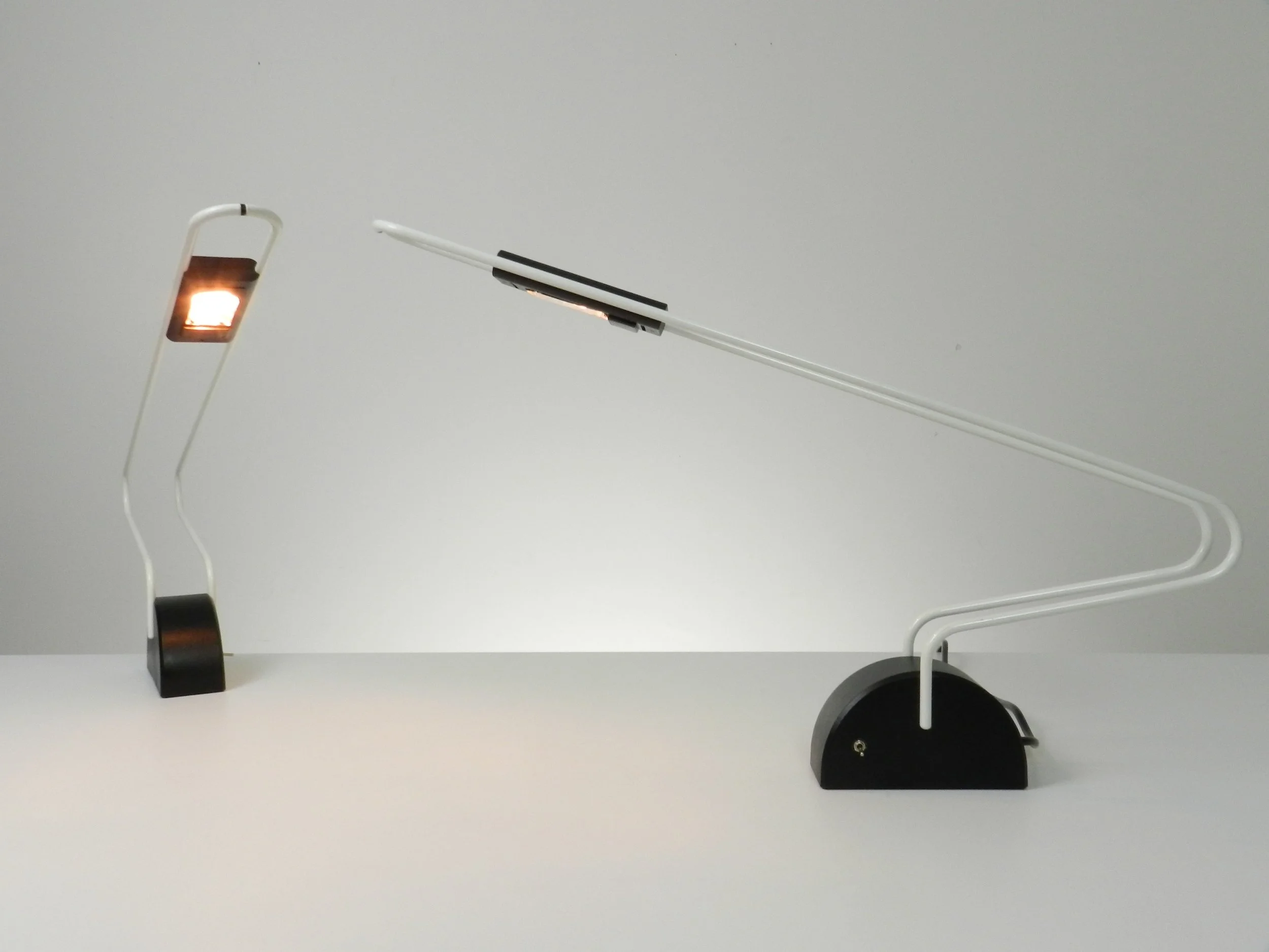 Pair of post modern halogen lamp in enameled metal and plastic. Maker unknown.  circa 1980s.