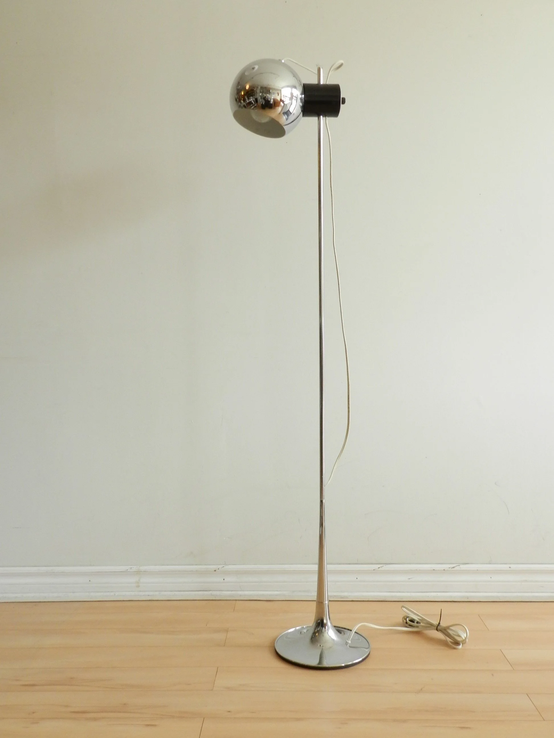 Chrome floor lamp with magnetic adjustament by Goffredo Reggiani.  Italy, 1960s.