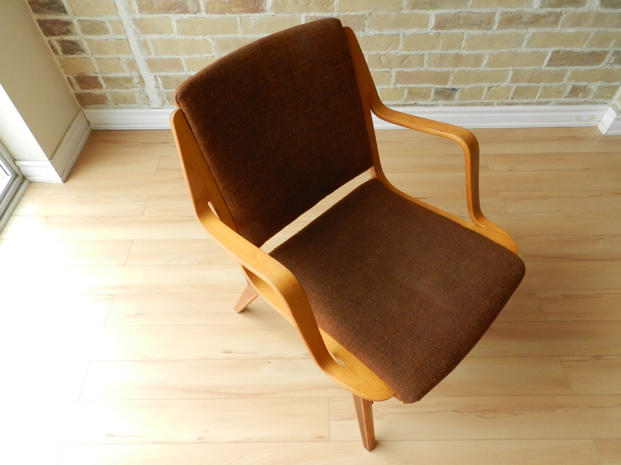 Ax lounge chair designed by Peter Hvidt and Orla Molgaard-Nielsen for Fritz Hansen. Laminated beech and teak with original upholstery.  Denmark, 1950s.