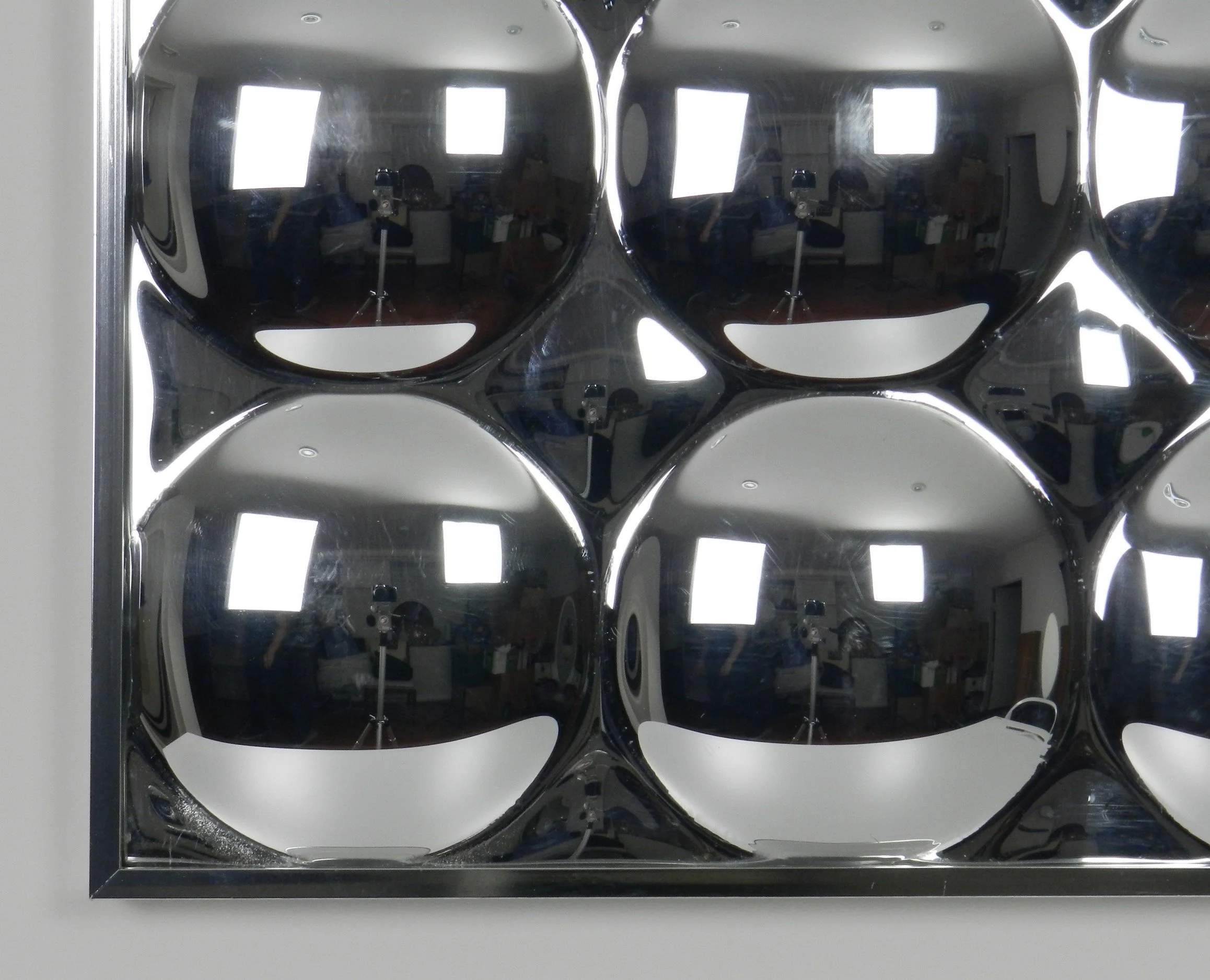 Vintage space age bubble mirror in molded plastic in chrome frame.  circa 1970s.