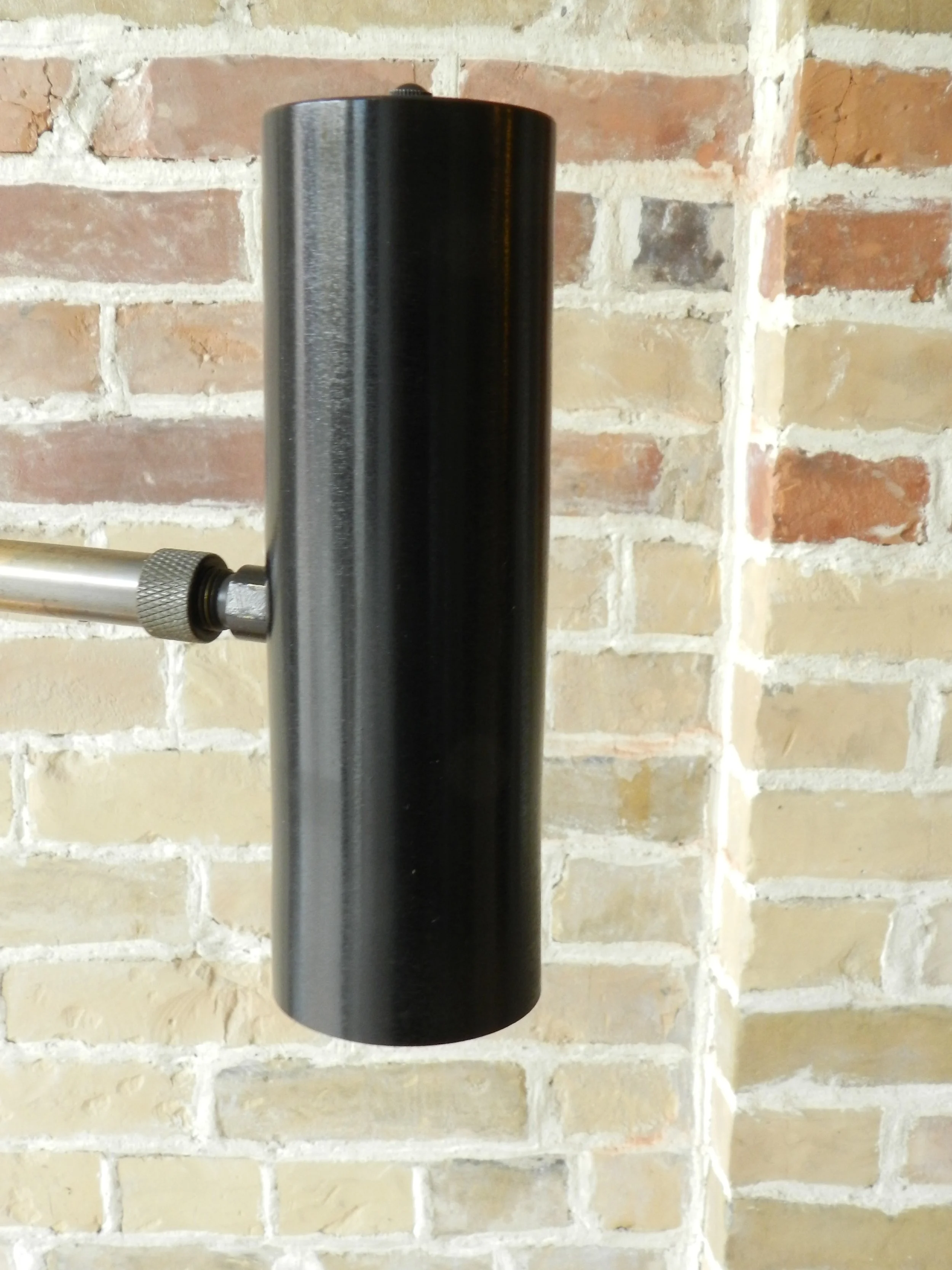 Modernist floor lamp in bronze plated arm, cast iron base and anodized aluminum shade. Designed by Robert Sonneman.  USA, 1960s.