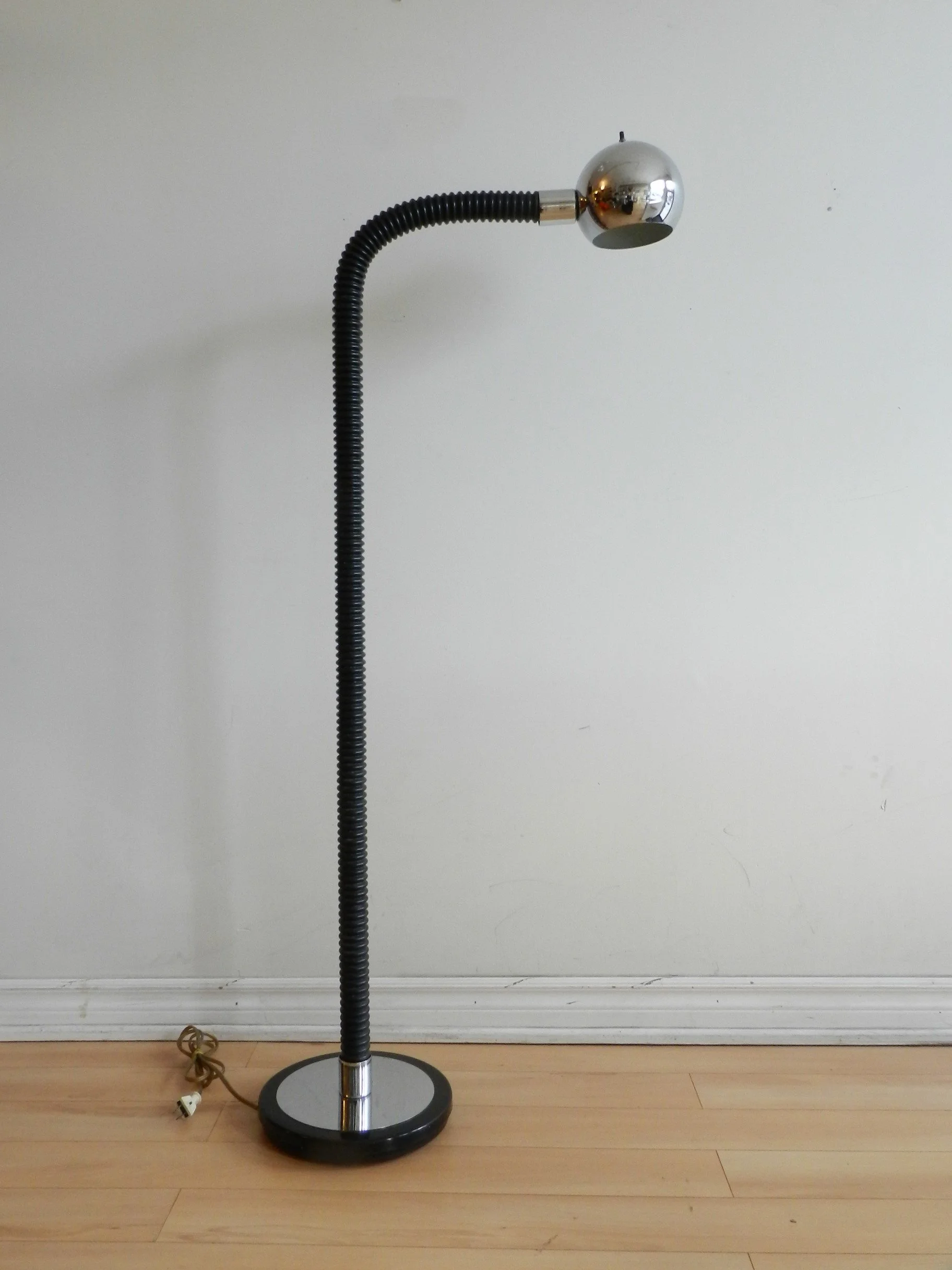 Space age floor lamp in chrome and flexible plastic.  circa 1970s.