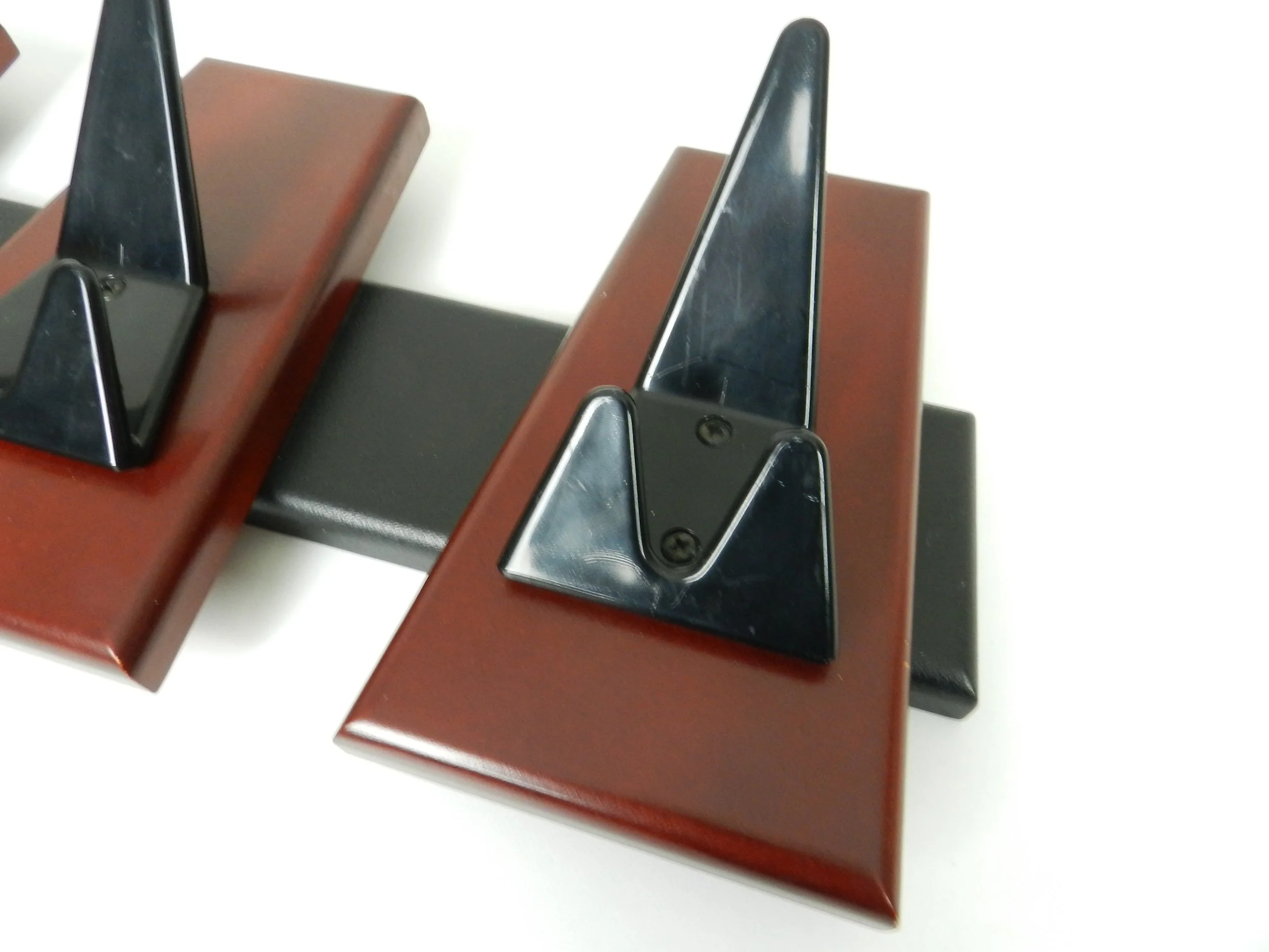 Modernist coat rack in wood and enameled metal.  circa 1980s.