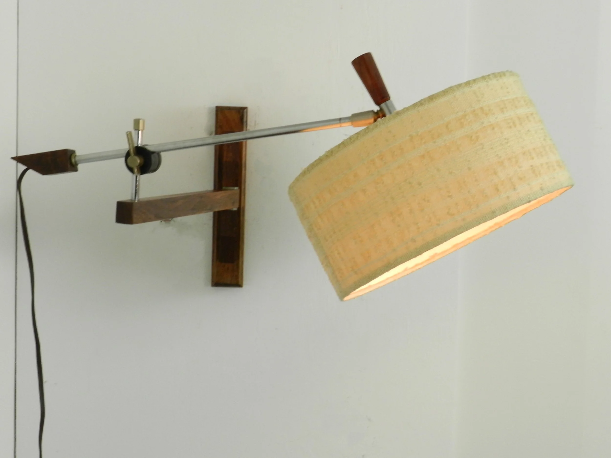 Scandinavian rosewood and chrome articulating wall lamp with original shade.  circa 1960s.