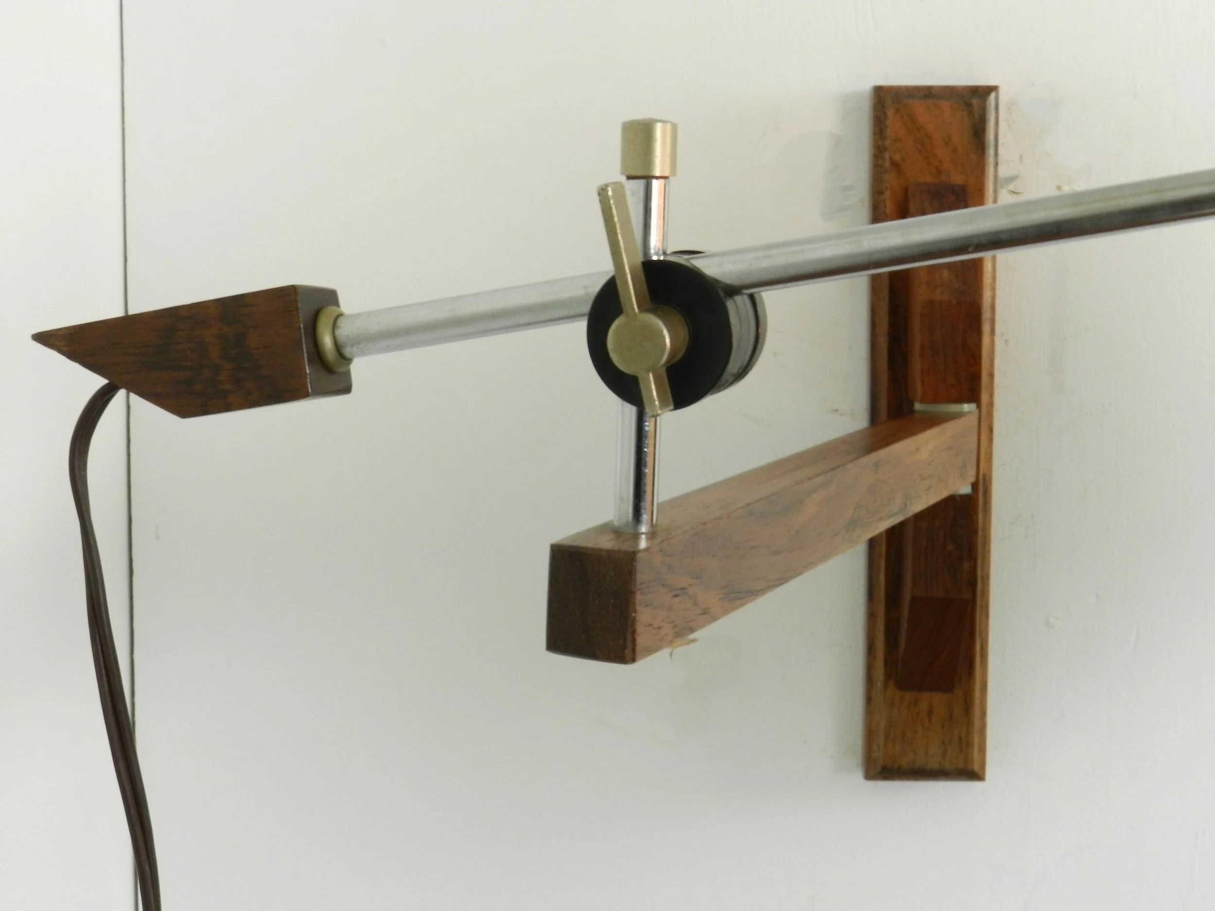 Scandinavian rosewood and chrome articulating wall lamp with original shade.  circa 1960s.