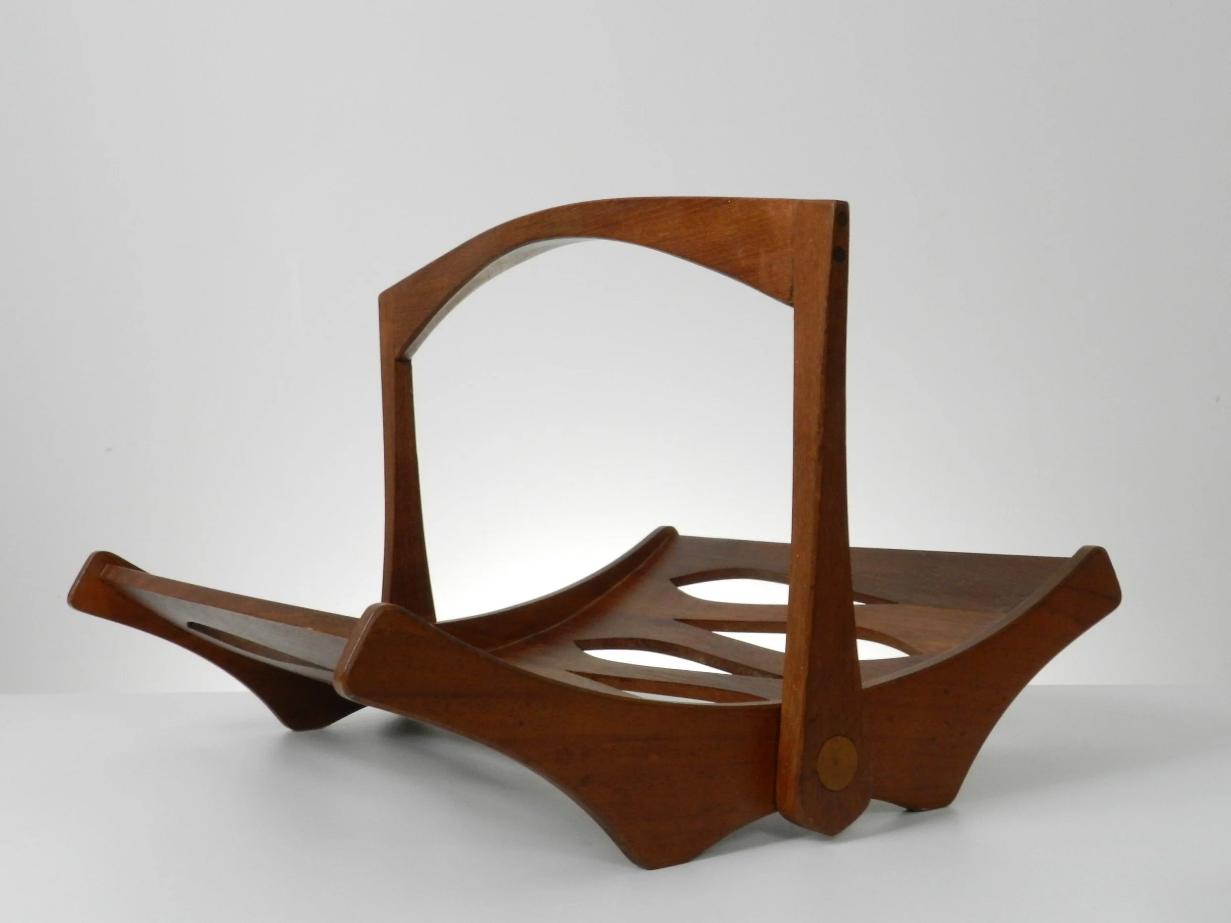 Solid teak magazine rack designed by Jens Quistgaard for Dansk.  Denmark, 1960s.