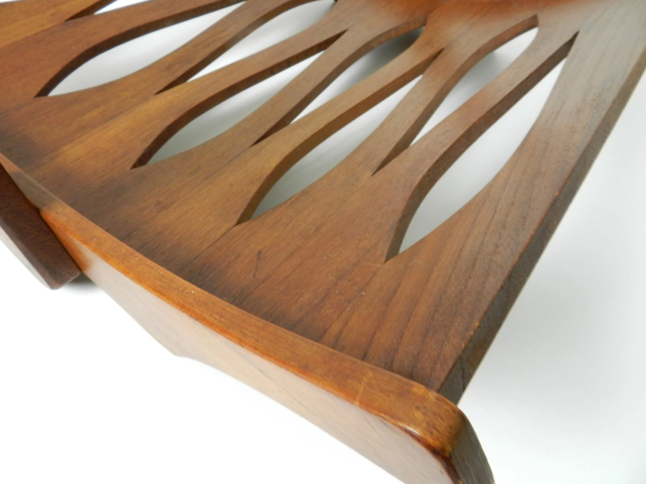 Solid teak magazine rack designed by Jens Quistgaard for Dansk.  Denmark, 1960s.