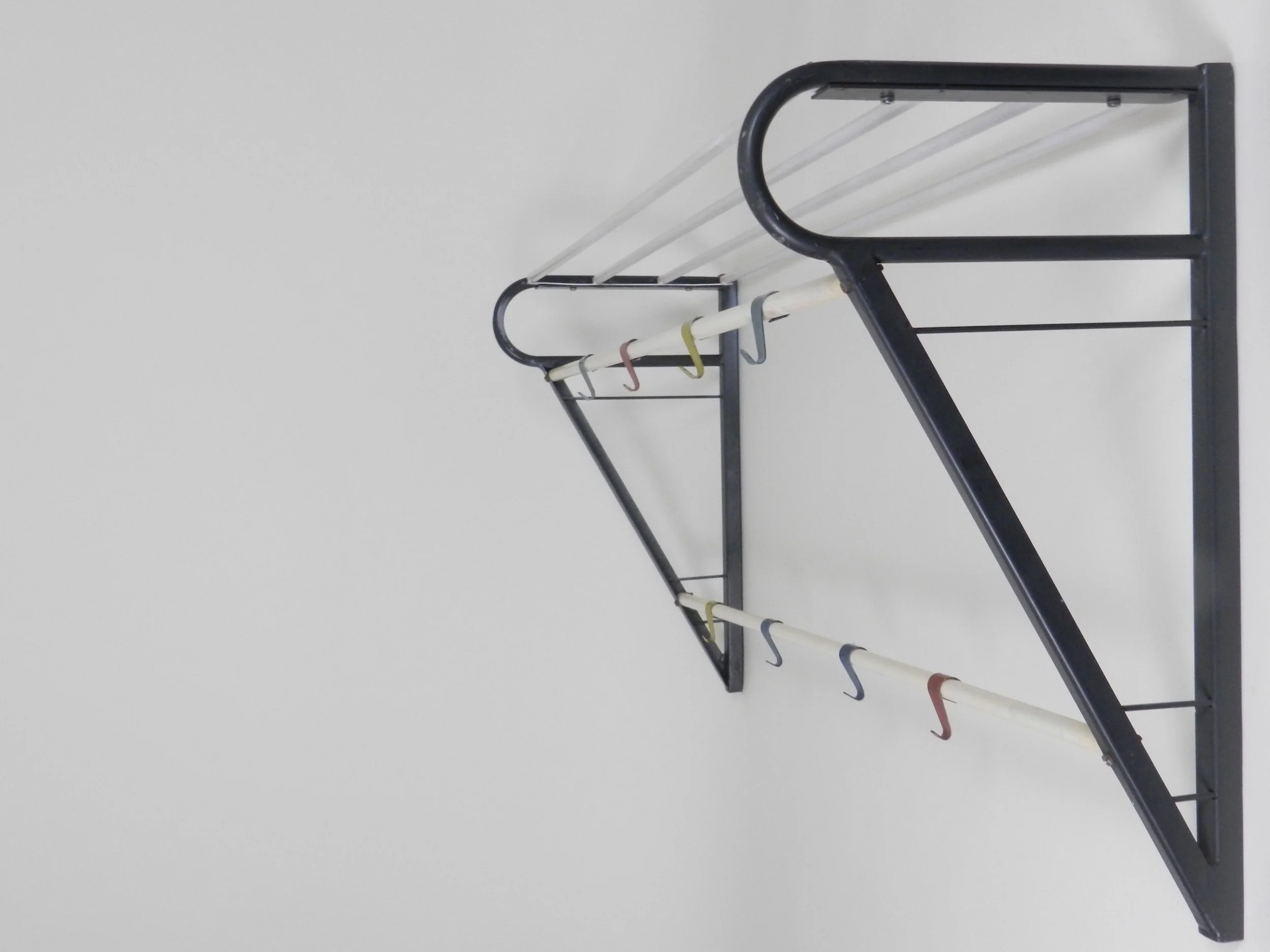 Mid century vintage enameled metal coat rack designed by Coen de Vries for Devo.  Netherlands, 1950s
