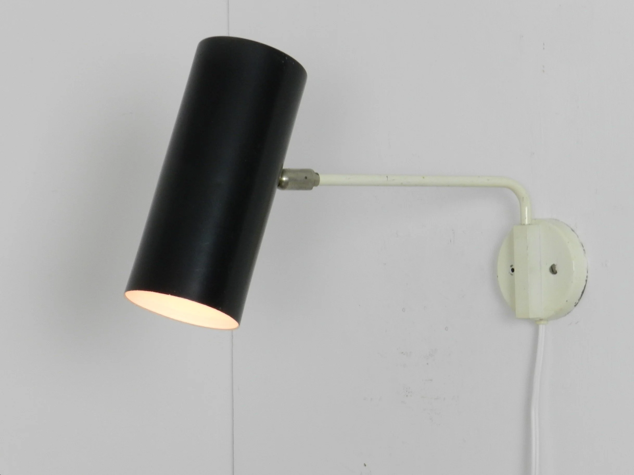 Modernist wall lamp by Raak.  Netherlands, 1960s.