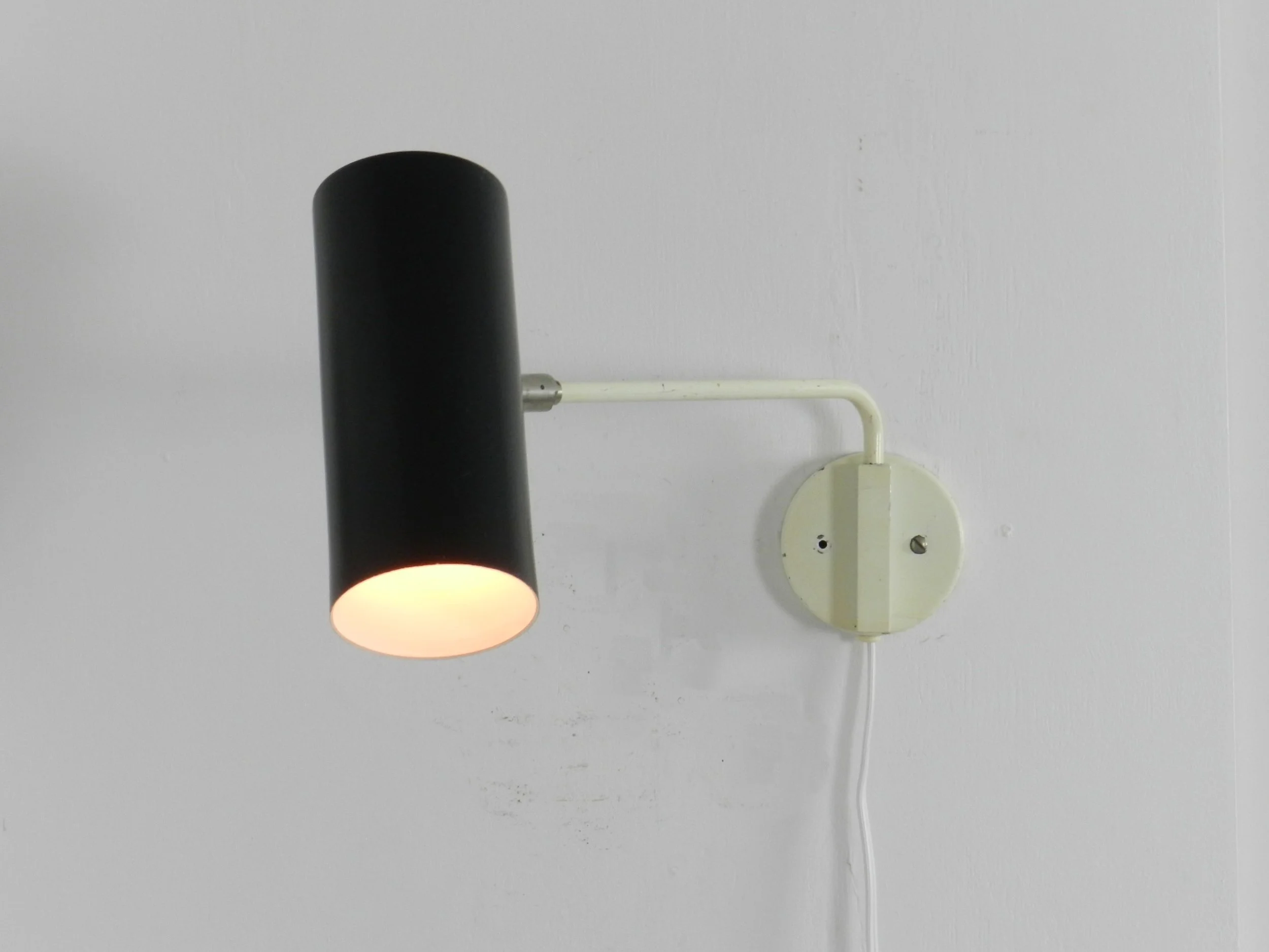 Modernist wall lamp by Raak.  Netherlands, 1960s.