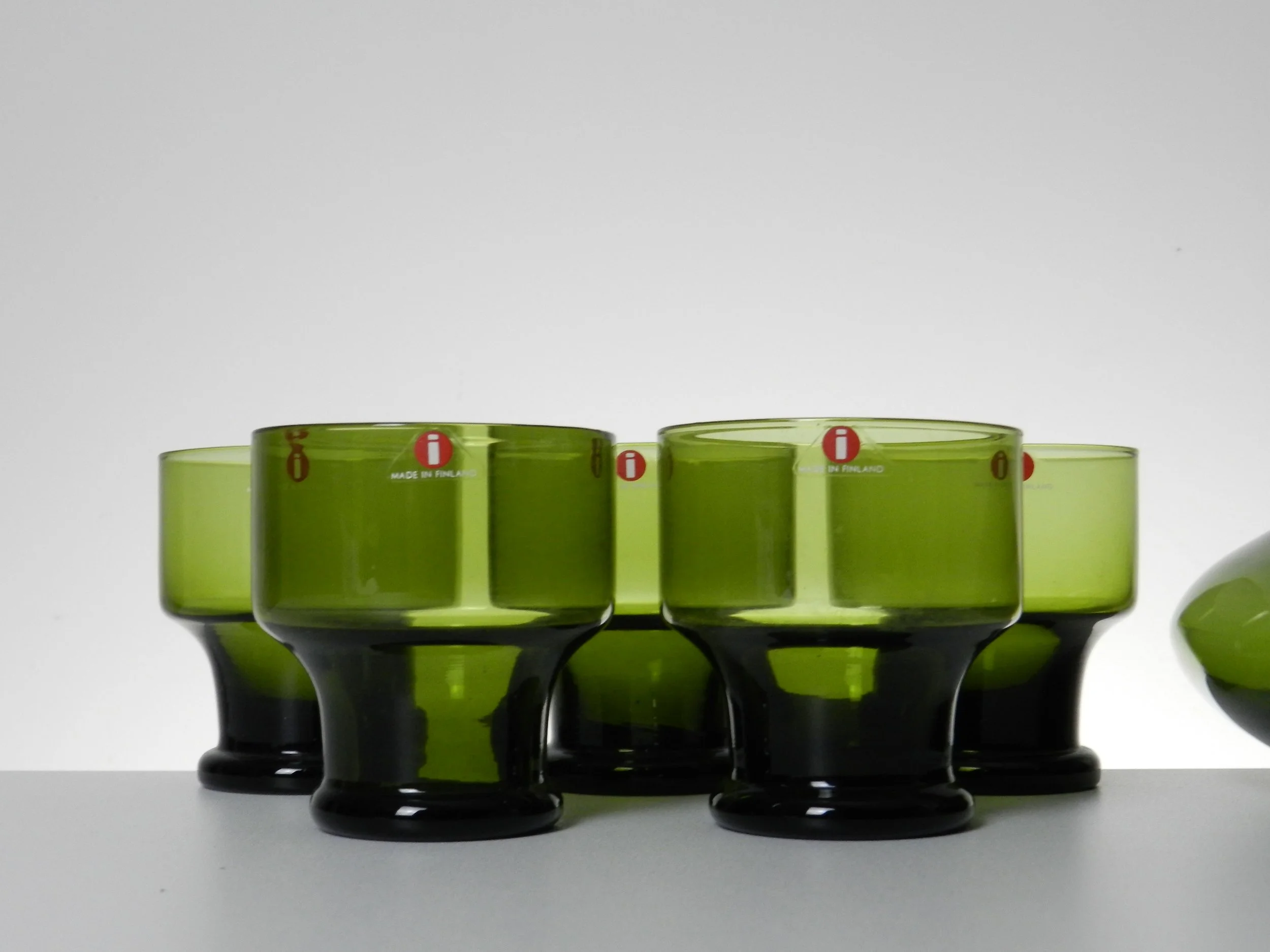 Glass drink set designed by Timo Sarpaneva for IIttala. Set includes pitcher/decanter and 5 glasses. Signed on base “TS”.  Finland, 1970s.