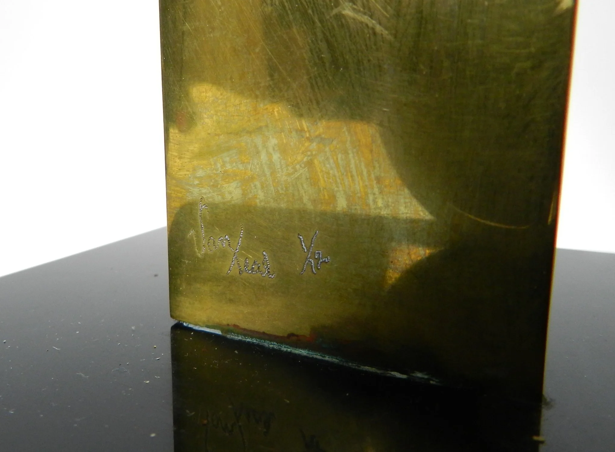 Abstract sculpture in lacquered brass and black acrylic base by Hivo G. Van Teal. Signed and numbered 1/12.  American, 1970s.