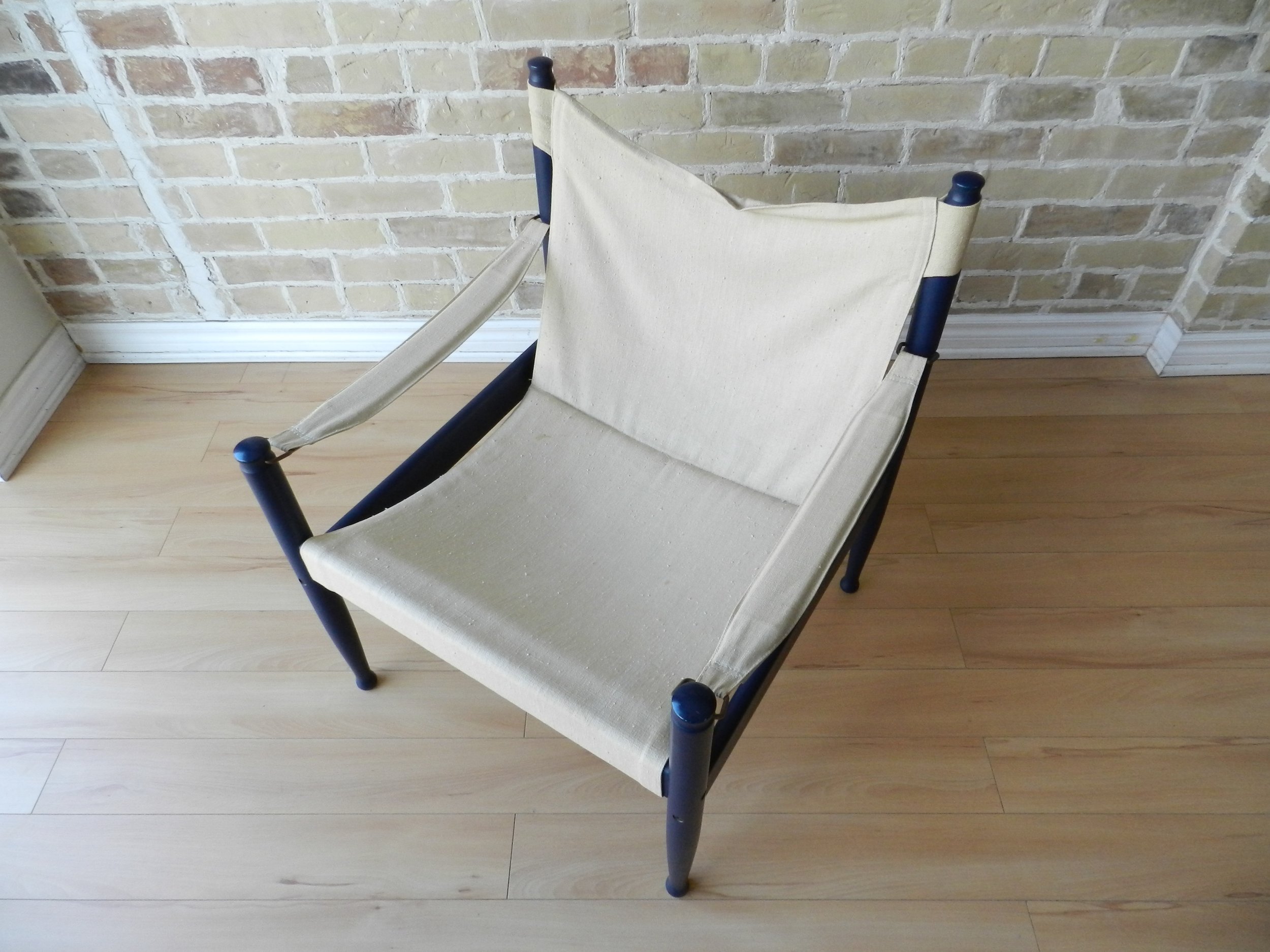 Safari lounge chair designed by Erik Worts for Niels Eilersen. Painted wood with canvas upholstery.  Denmark, 1960s.
