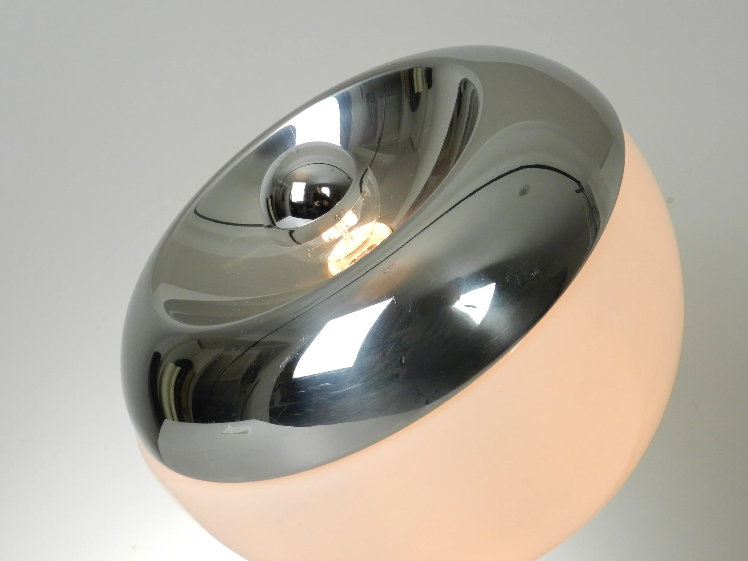 Large space age lamp in opaline glass and chrome by Reggiani. Can be used as a table or floor lamp.  Italy, 1970s.