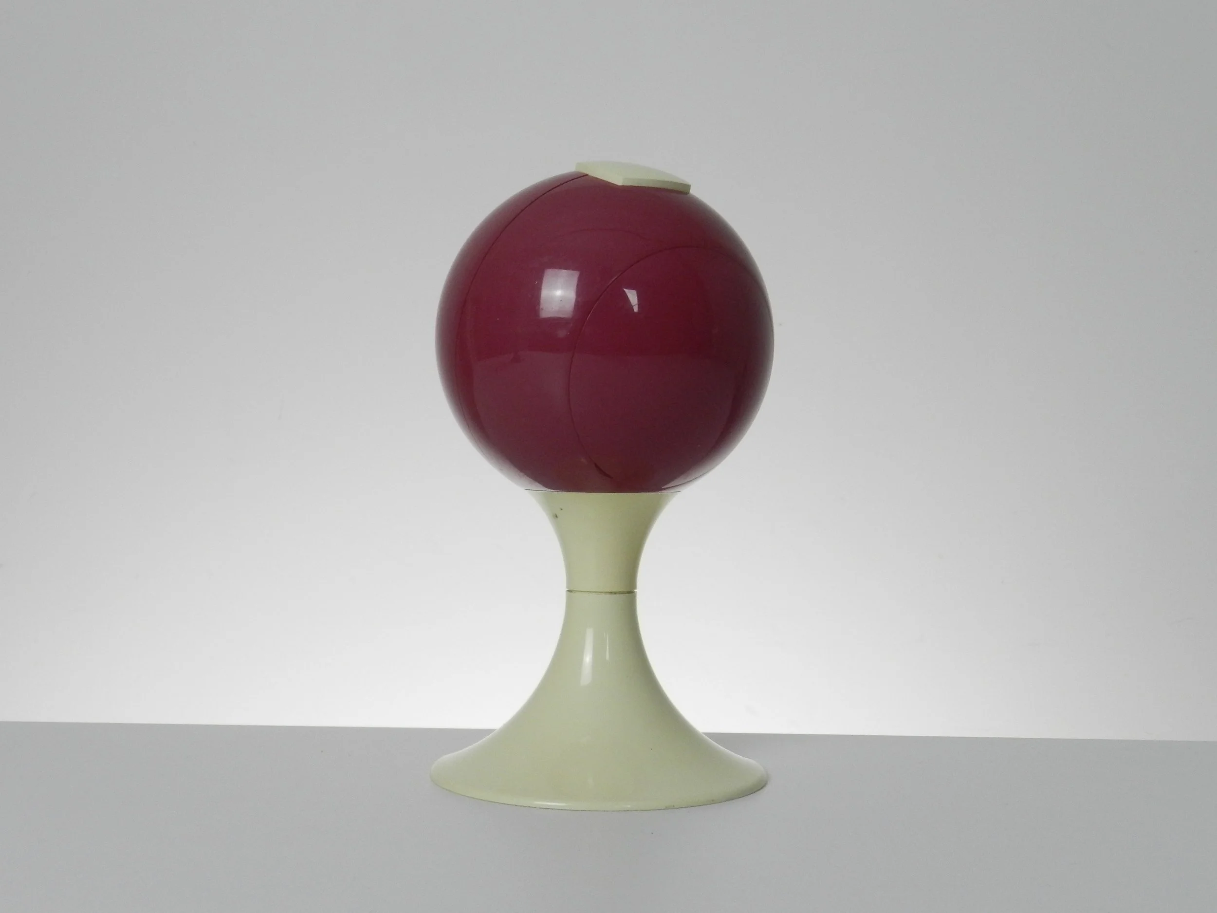 Space age pedestal clock in pink and cream colored plastic by Blessing.  West Germany, 1970s.