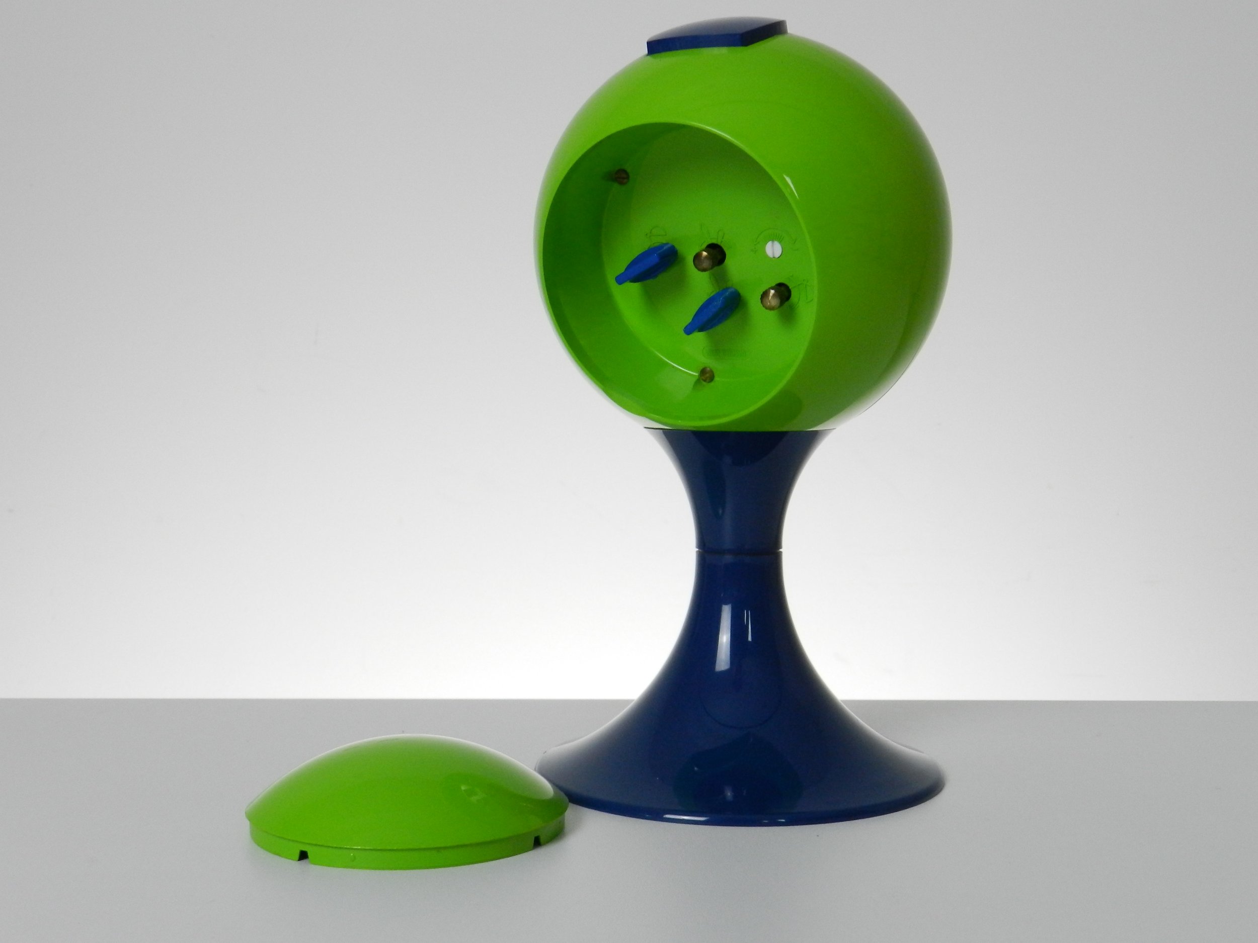 Space age pedestal clock in blue and green colored plastic by Blessing.  West Germany, 1970s.