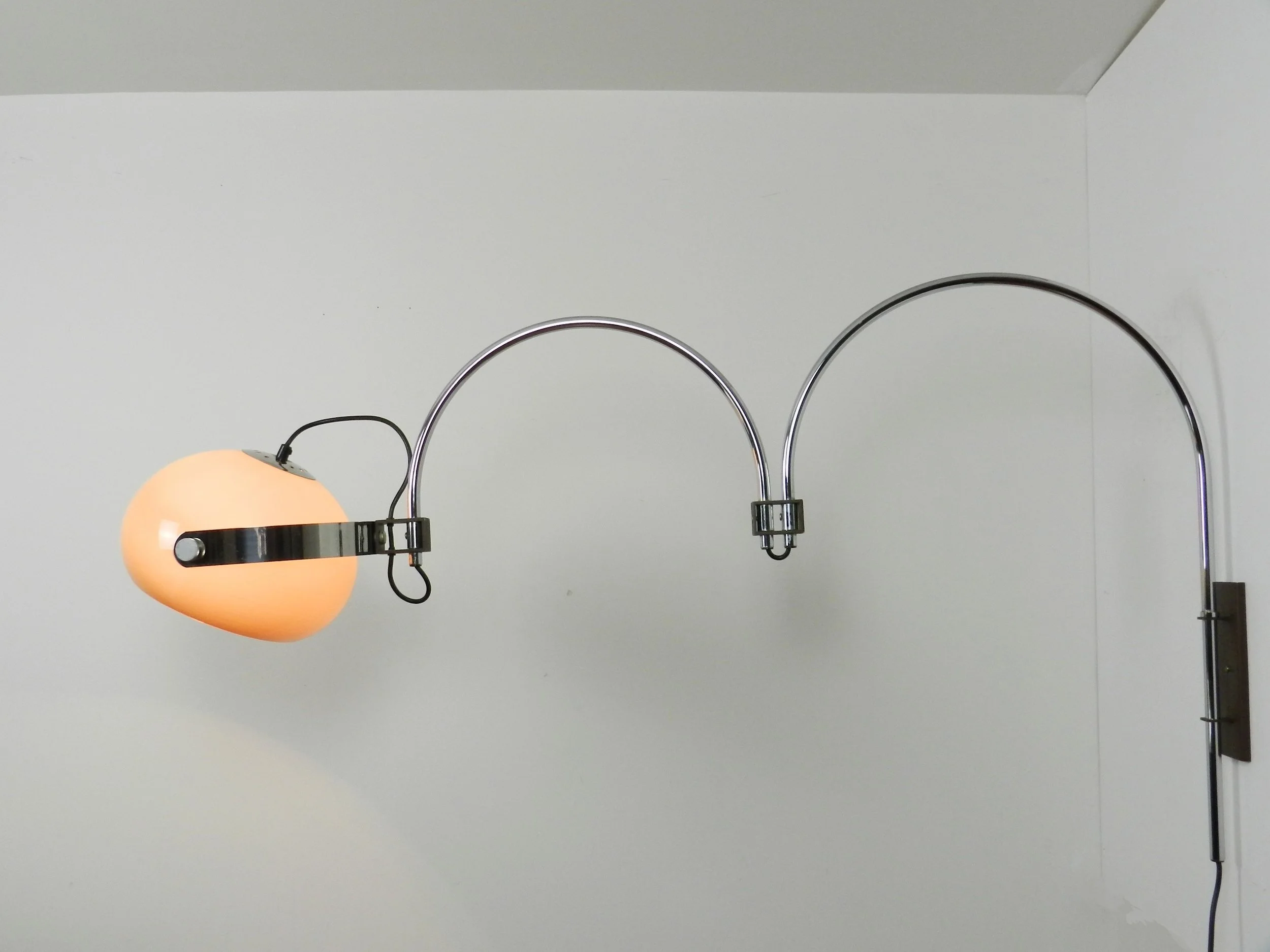 Space age double arc articulating wall lamp by Dijkstra. Chrome with plastic shade.  Netherlands, 1970s.
