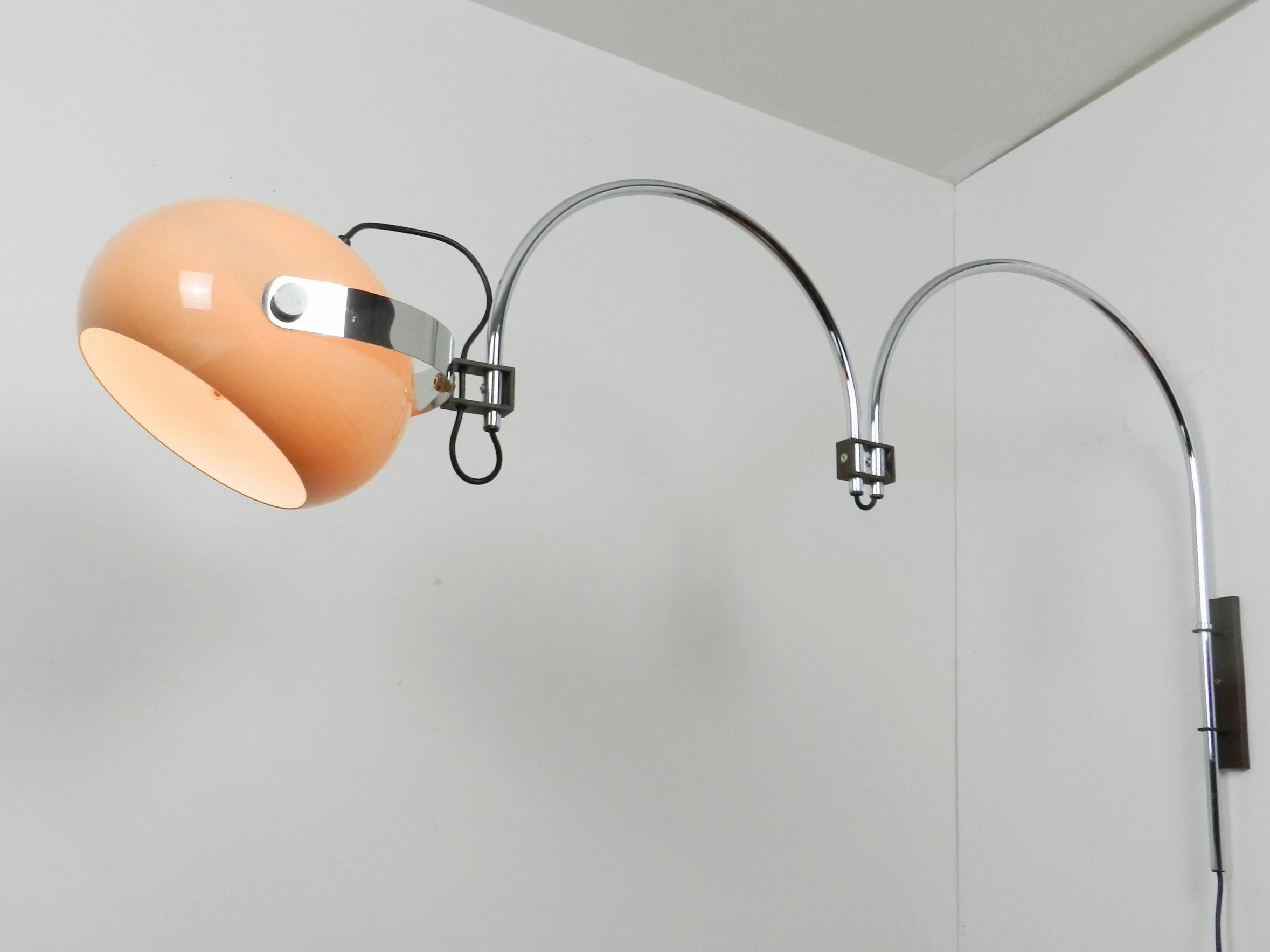 Space age double arc articulating wall lamp by Dijkstra. Chrome with plastic shade.  Netherlands, 1970s.