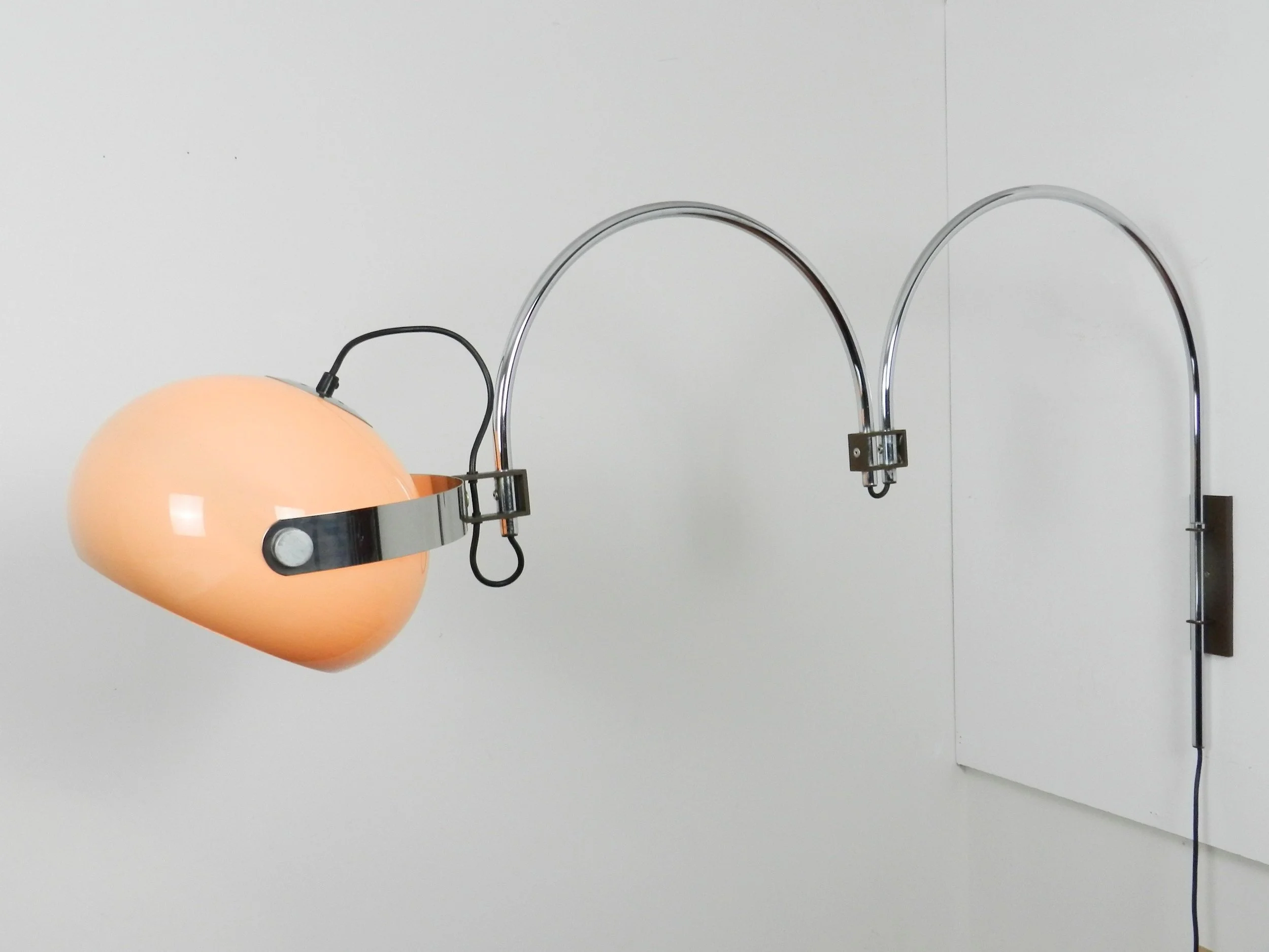 Space age double arc articulating wall lamp by Dijkstra. Chrome with plastic shade.  Netherlands, 1970s.