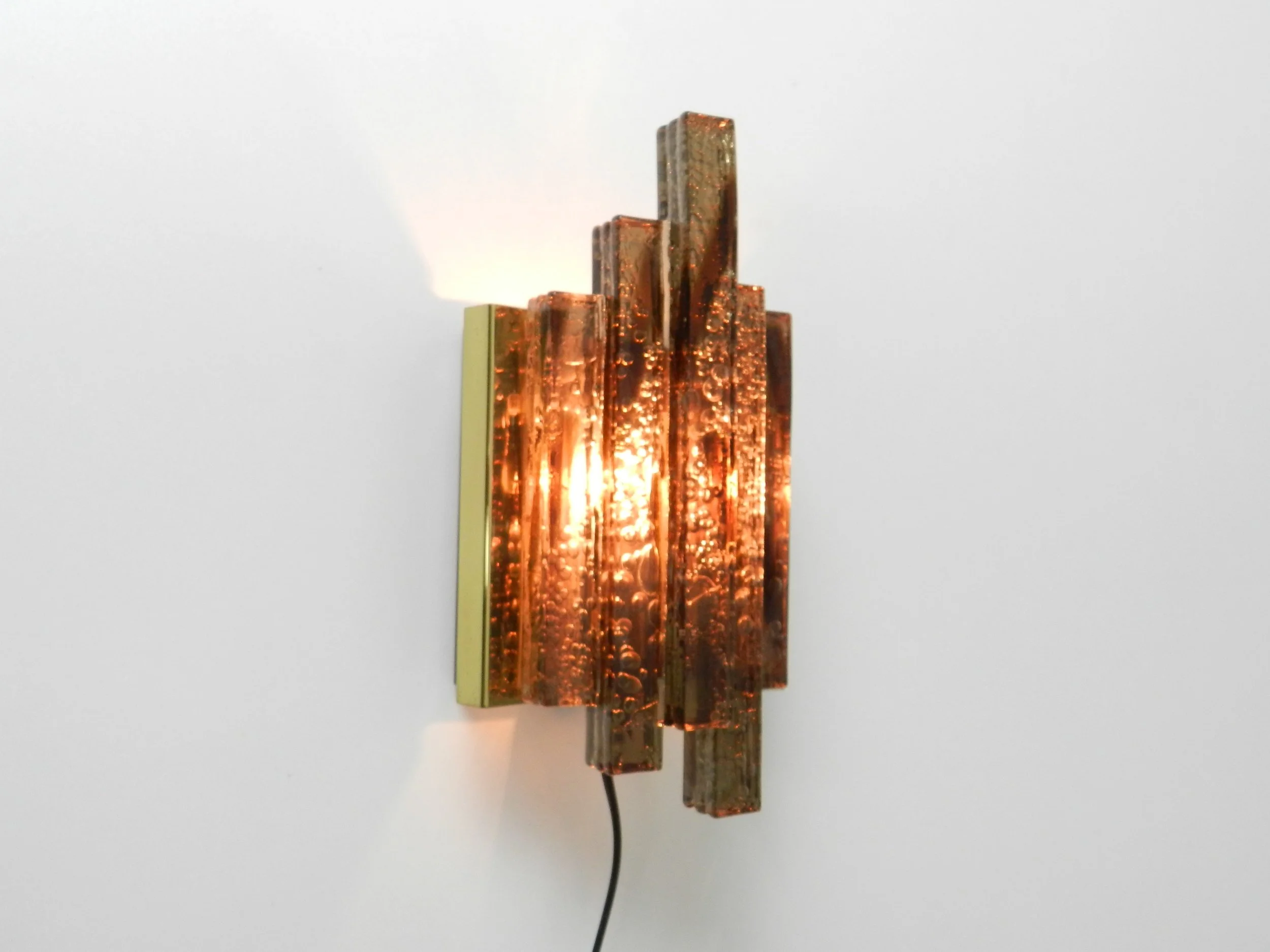Modernist wall lamp in colored and textured acrylic with brass frame.  Scandinavia, 1960s.
