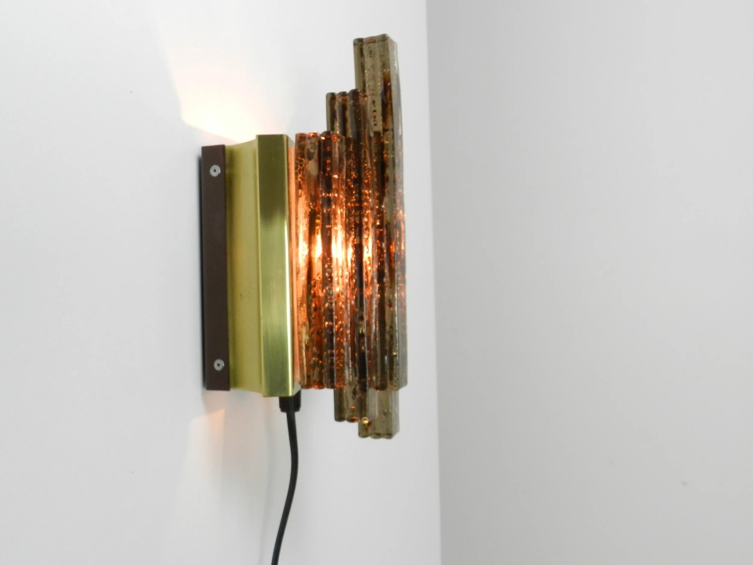 Modernist wall lamp in colored and textured acrylic with brass frame.  Scandinavia, 1960s.