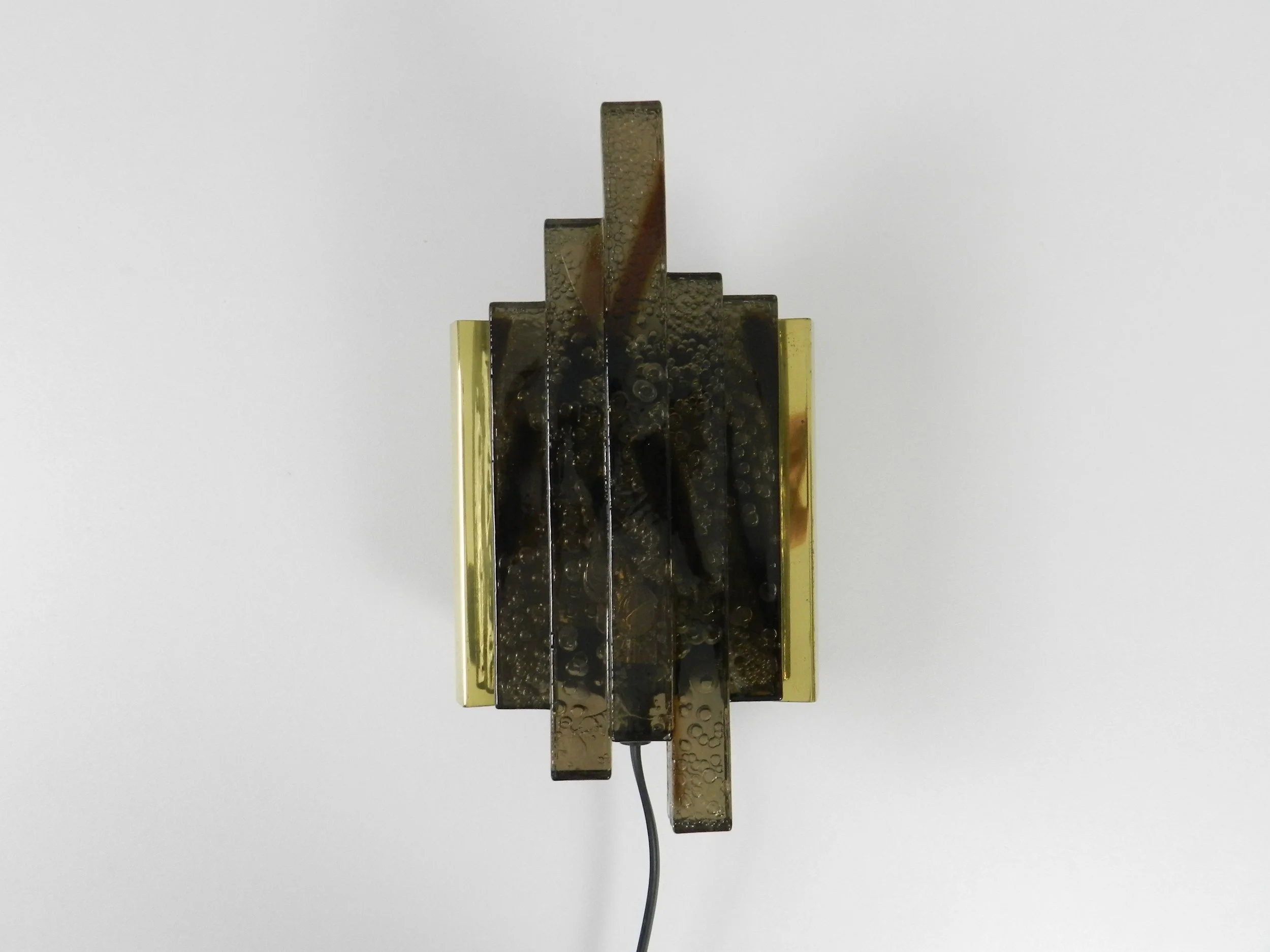 Modernist wall lamp in colored and textured acrylic with brass frame.  Scandinavia, 1960s.
