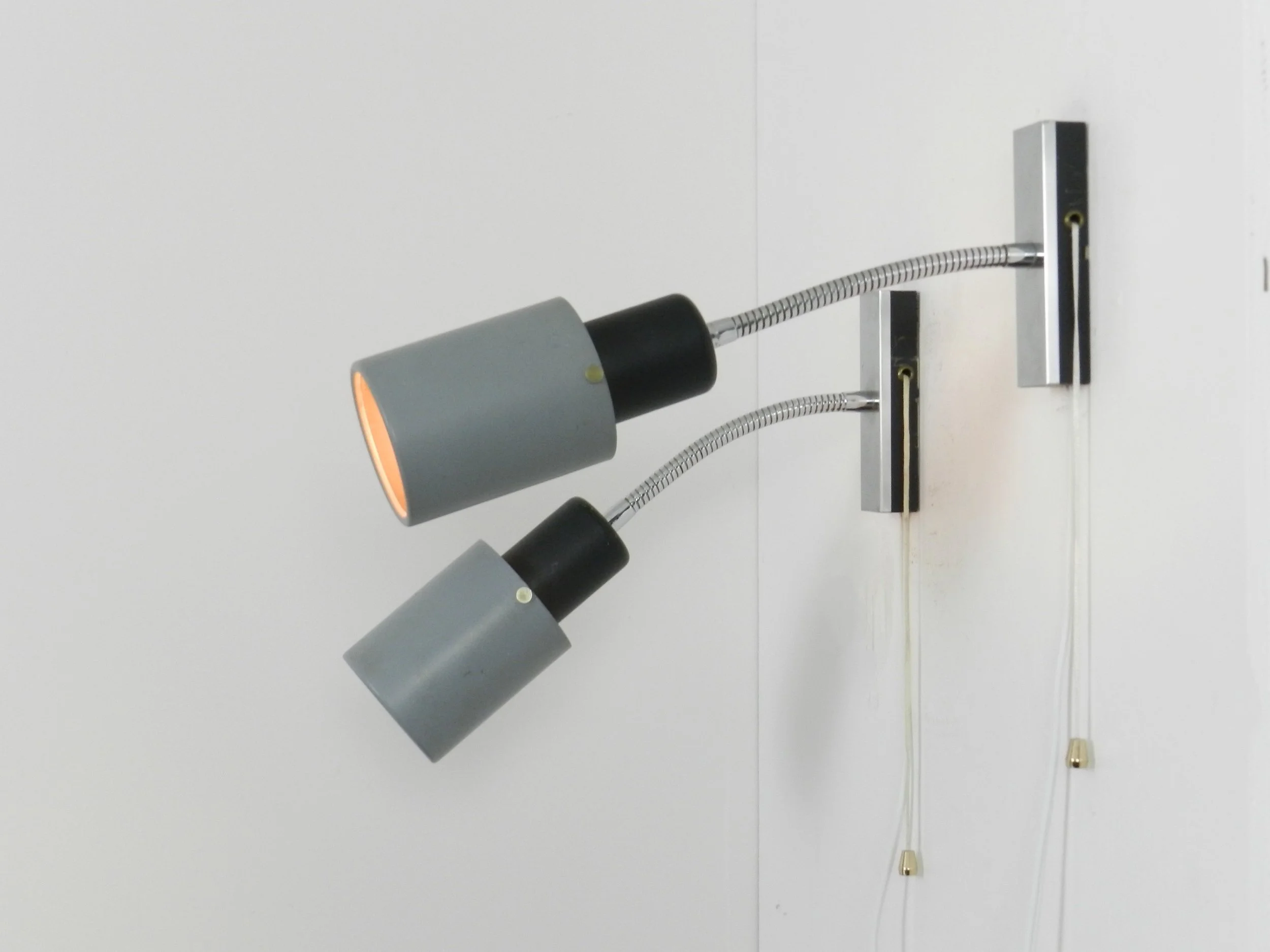 Pair of adjustable modernist wall lamps in painted metal and chrome.  Probably from France, 1960s.