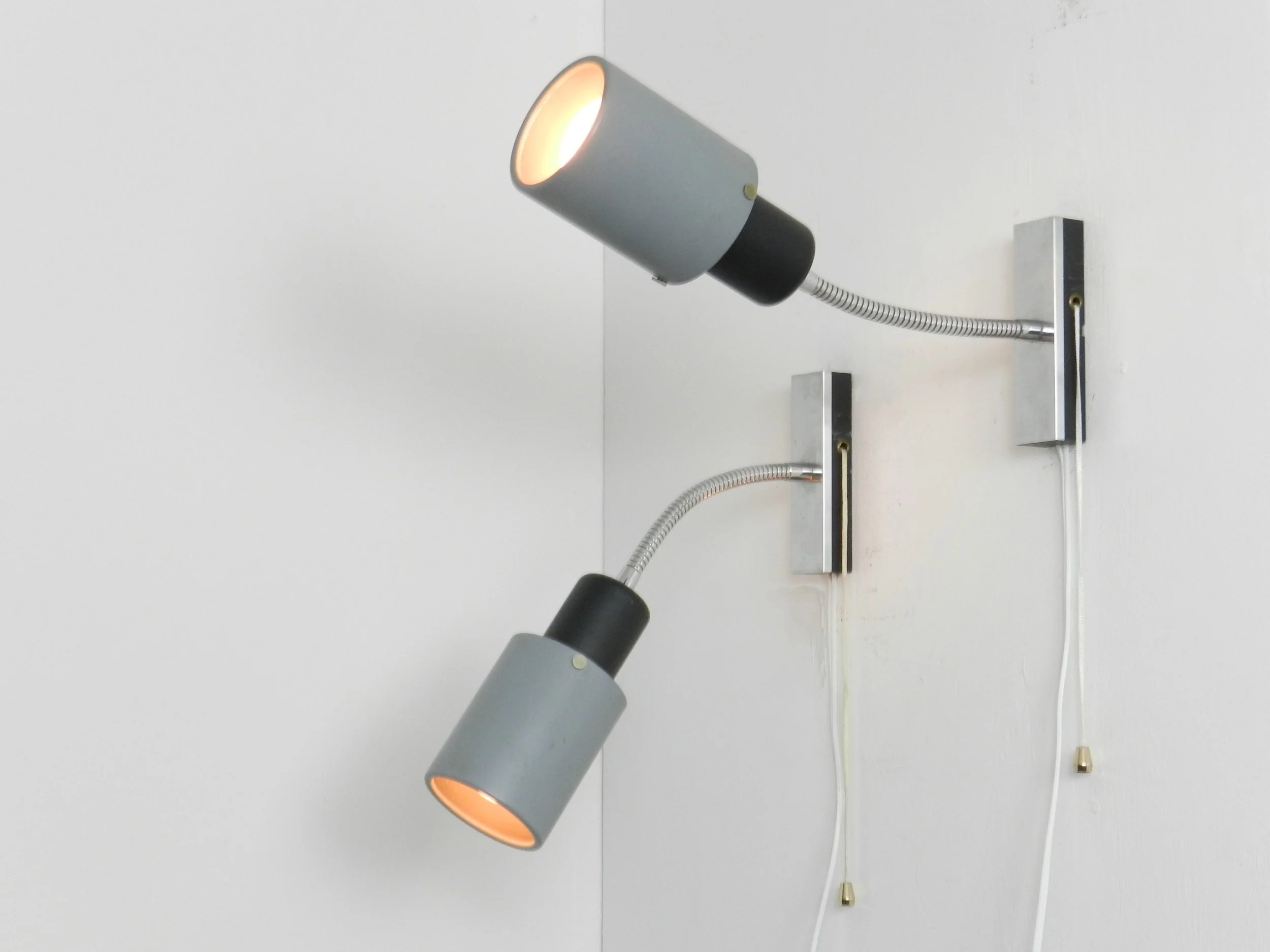 Pair of adjustable modernist wall lamps in painted metal and chrome.  Probably from France, 1960s.