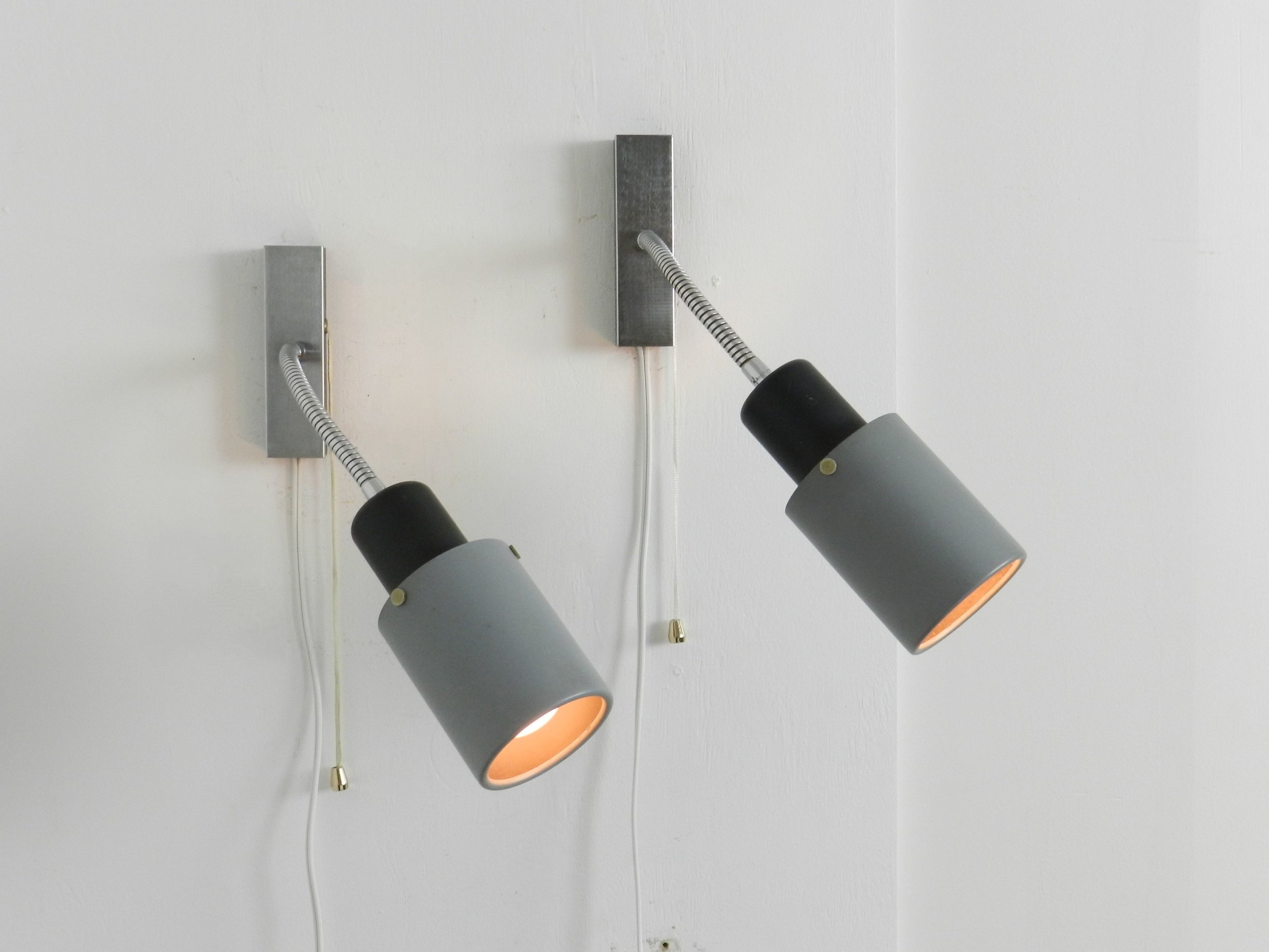 Pair of adjustable modernist wall lamps in painted metal and chrome.  Probably from France, 1960s.