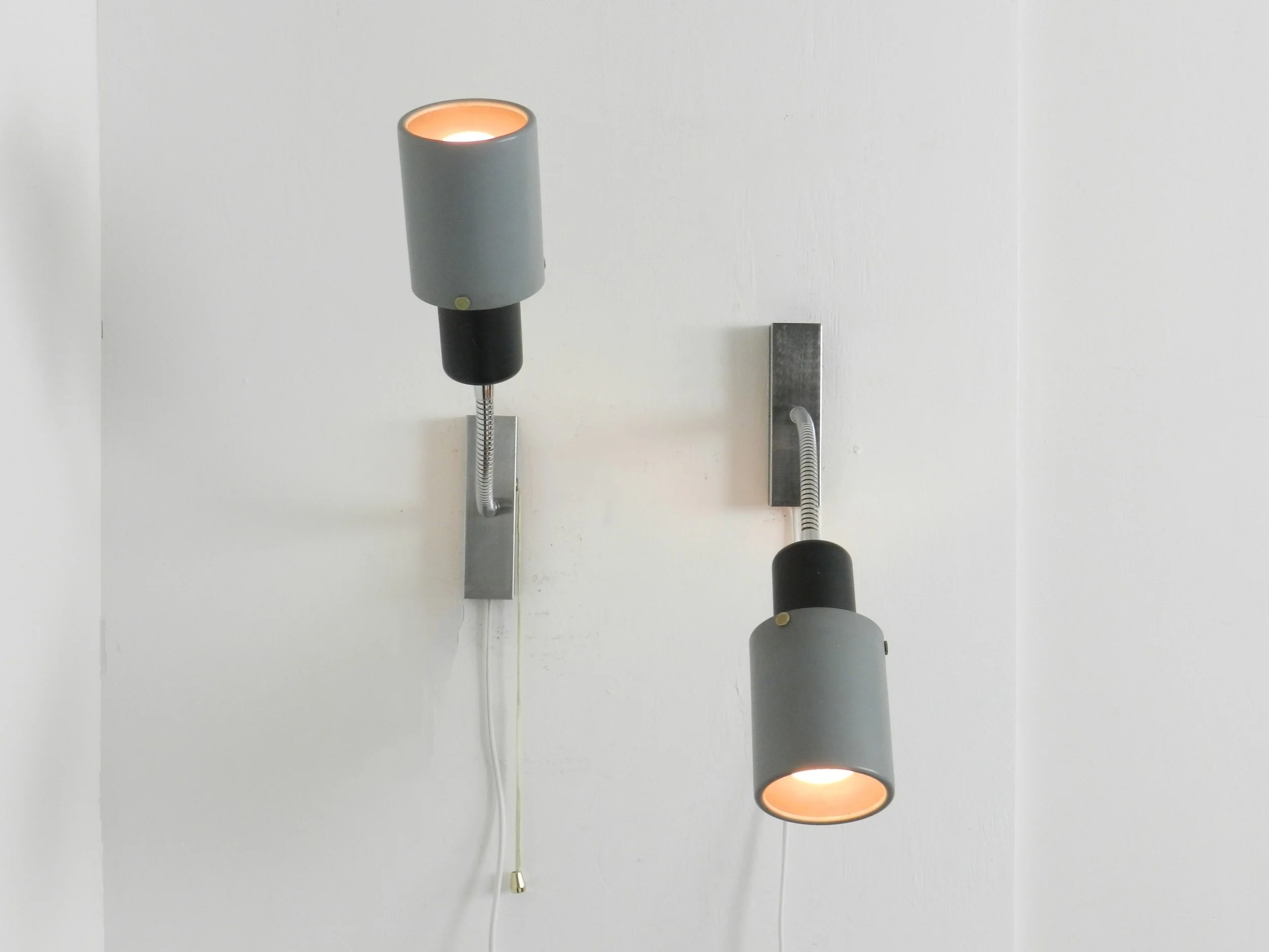 Pair of adjustable modernist wall lamps in painted metal and chrome.  Probably from France, 1960s.