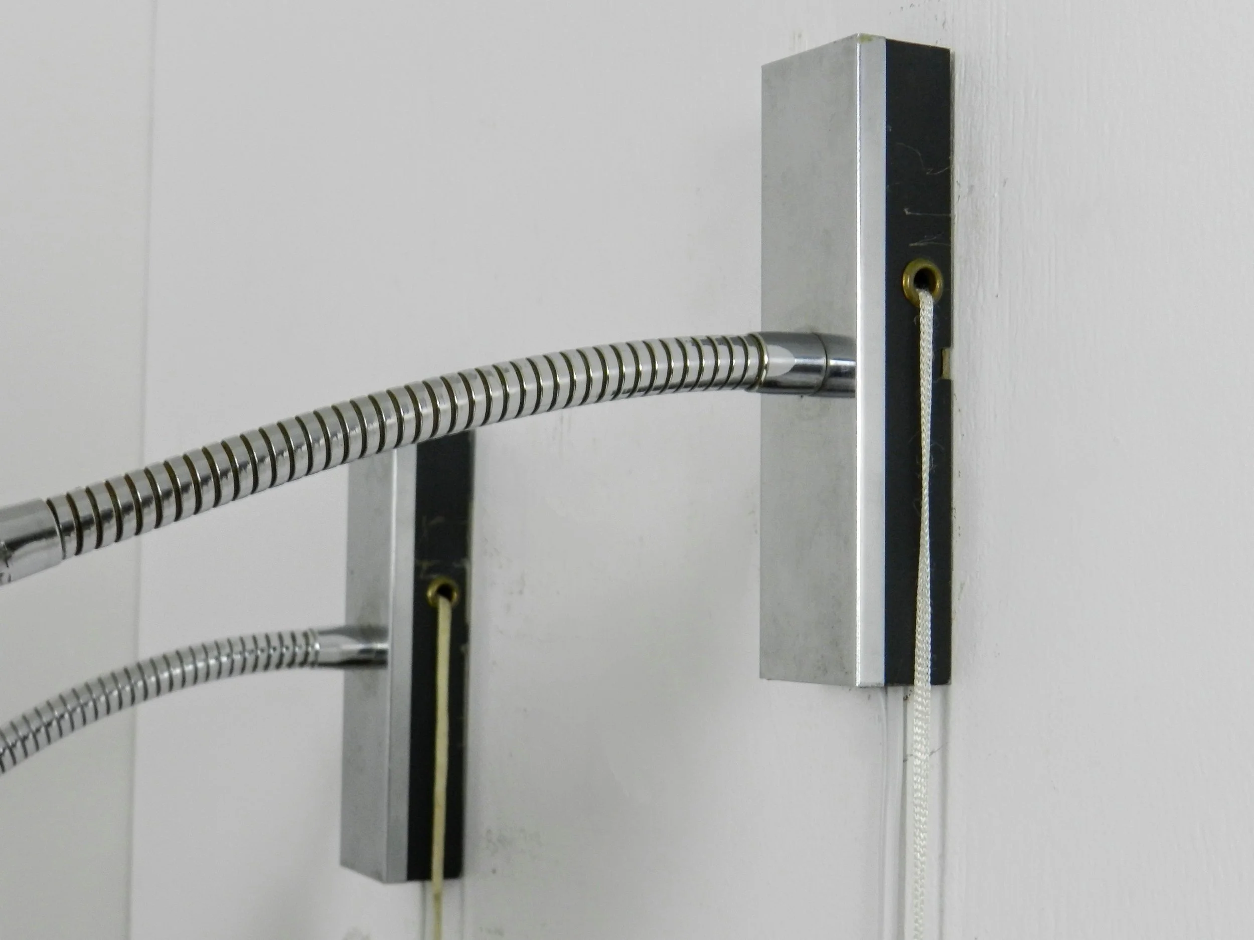 Pair of adjustable modernist wall lamps in painted metal and chrome.  Probably from France, 1960s.