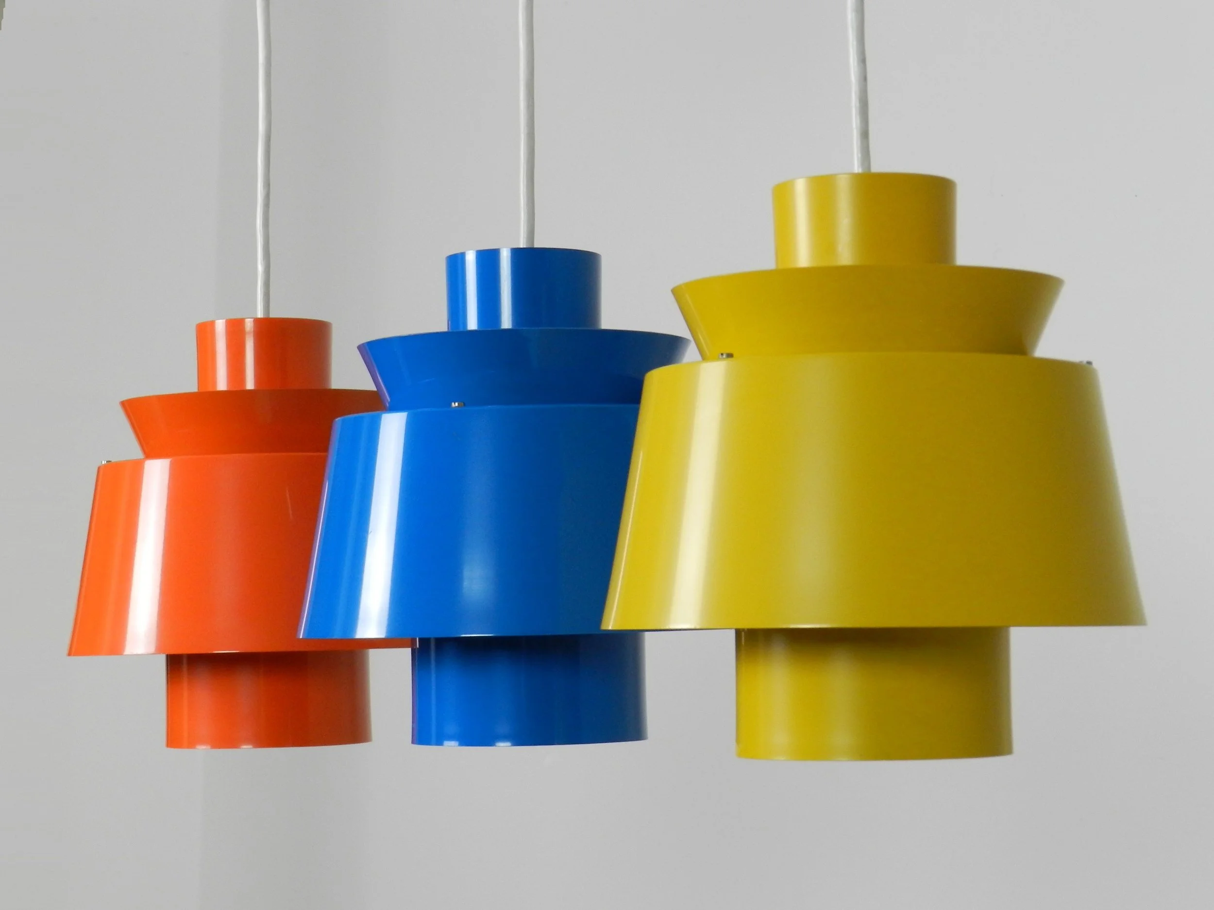 Set of 3 colourful Tivoli pendant lamps designed by Jorn Utzon for Nordisk Solar.  Denmark, 1960s.