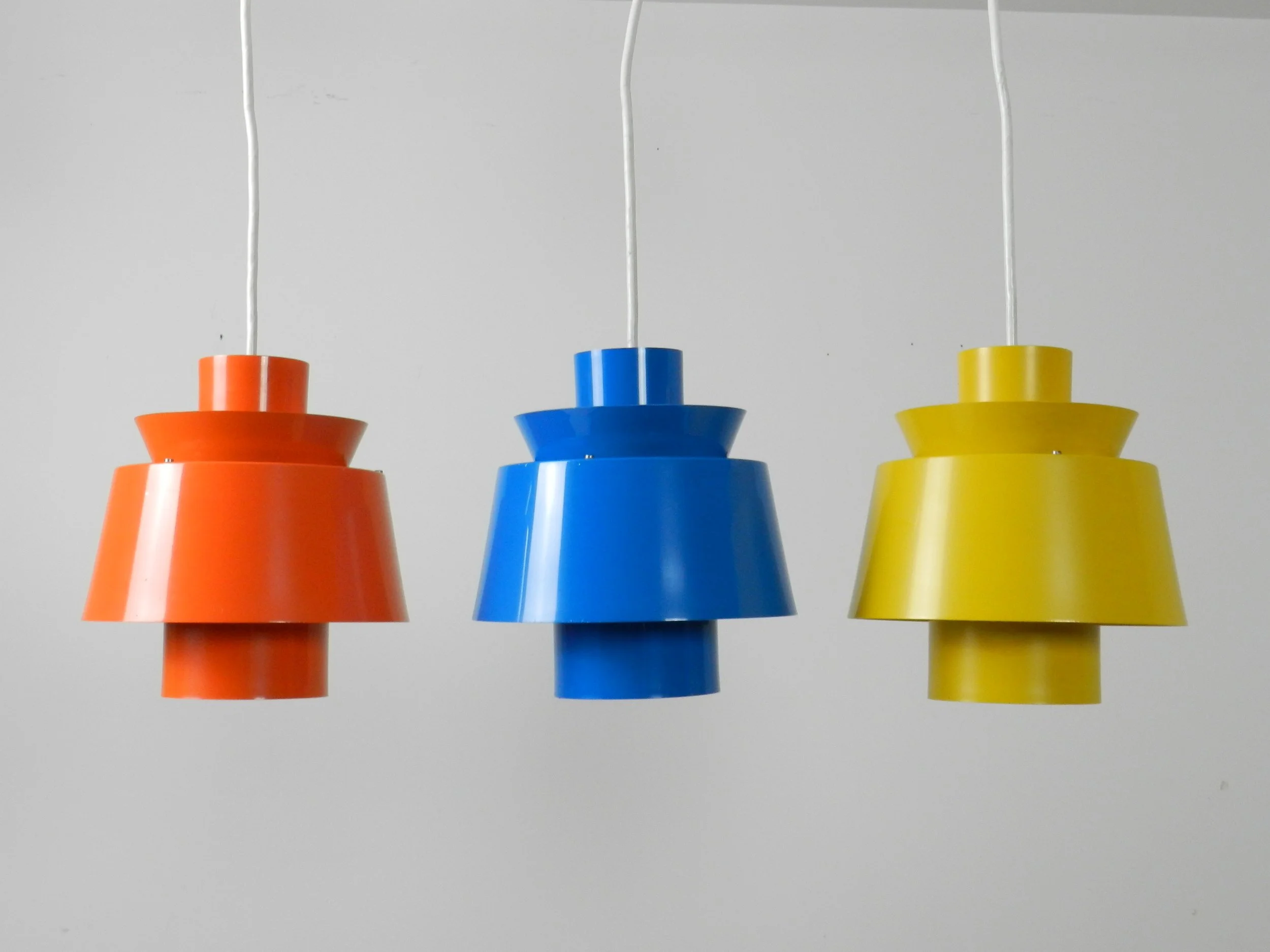 Set of 3 colourful Tivoli pendant lamps designed by Jorn Utzon for Nordisk Solar.  Denmark, 1960s.