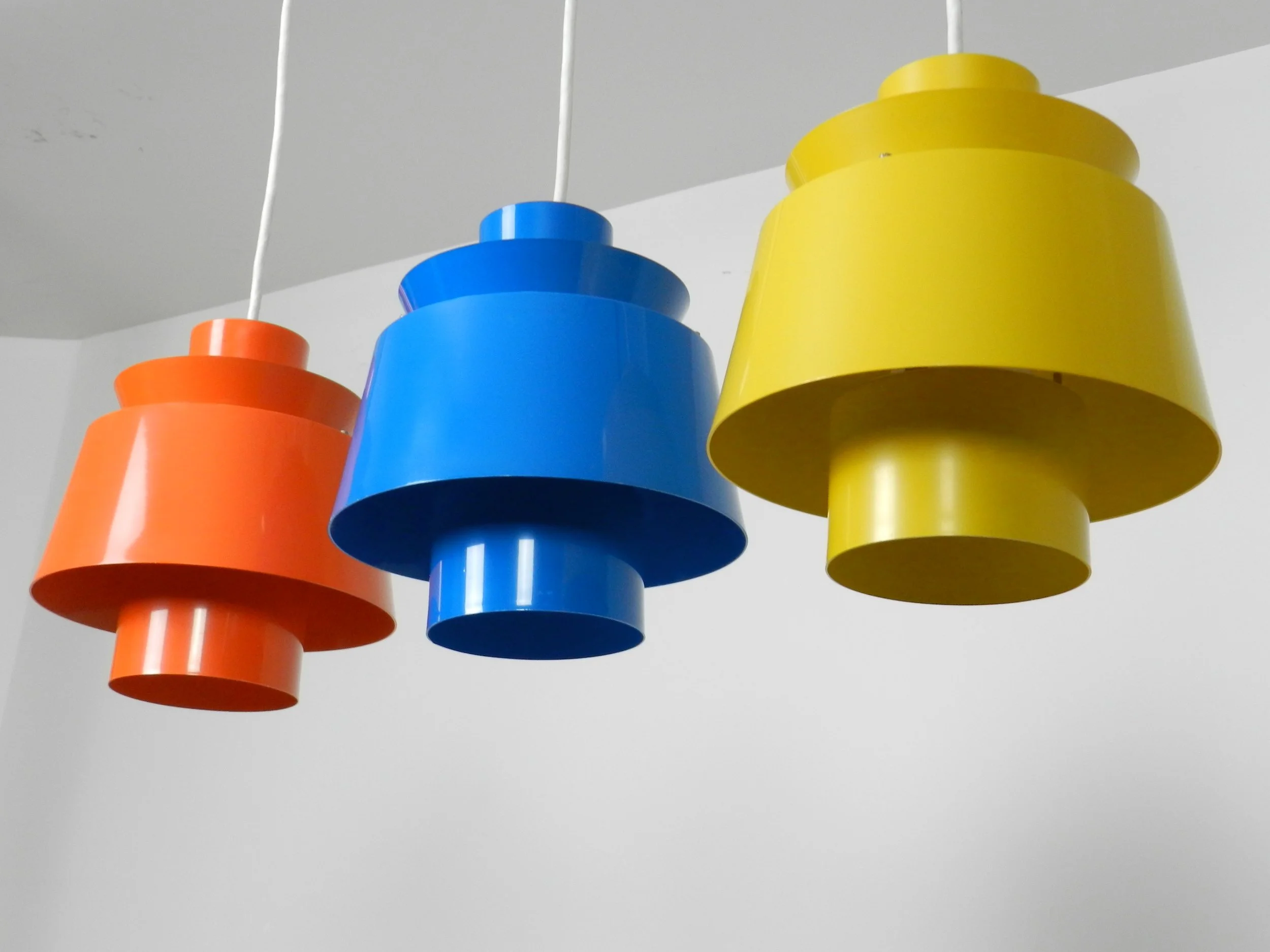 Set of 3 colourful Tivoli pendant lamps designed by Jorn Utzon for Nordisk Solar.  Denmark, 1960s.