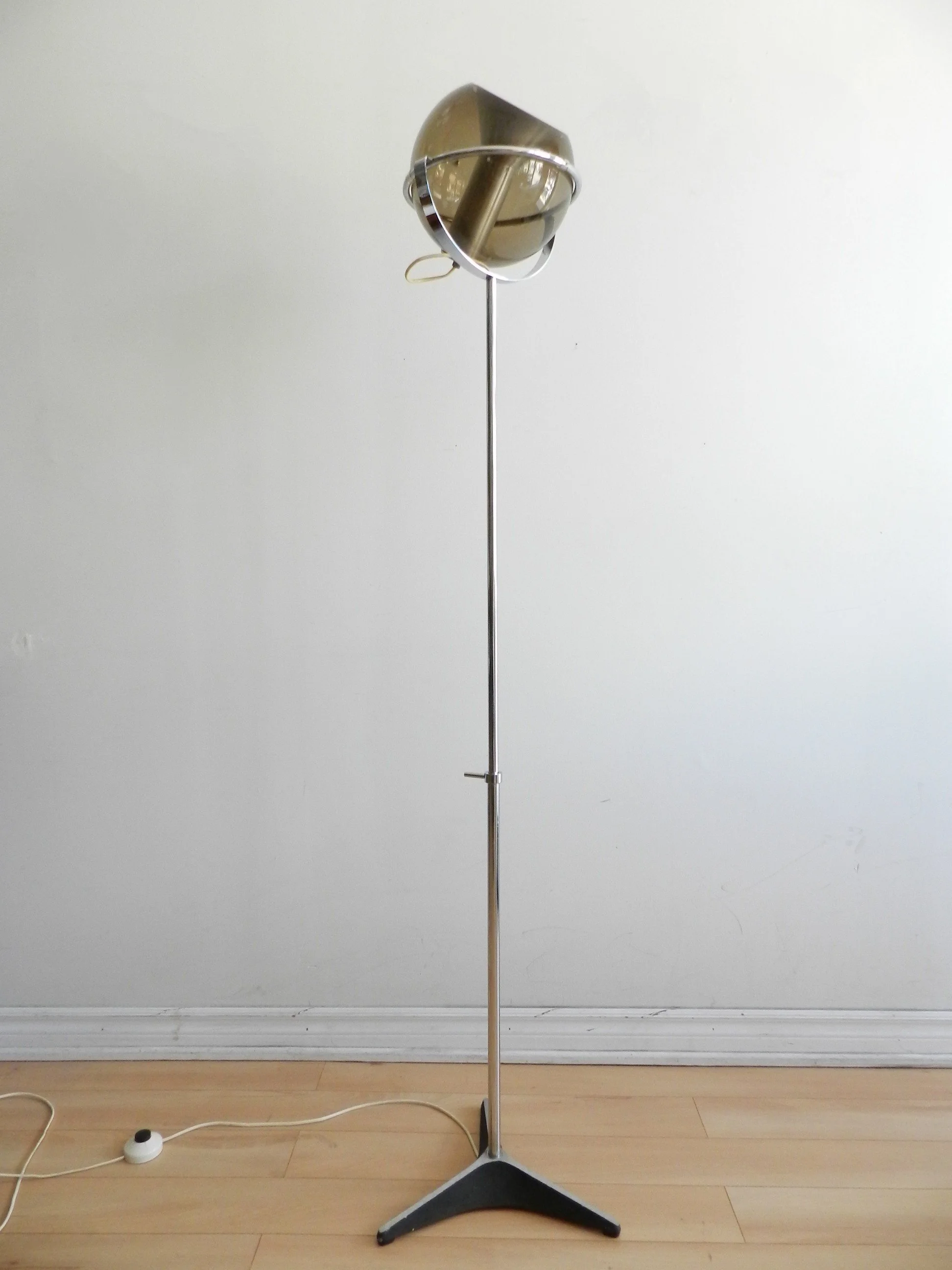 Chrome and glass floor lamp designed by Frank Ligtelijn for Raak.  Netherlands, 1960s.