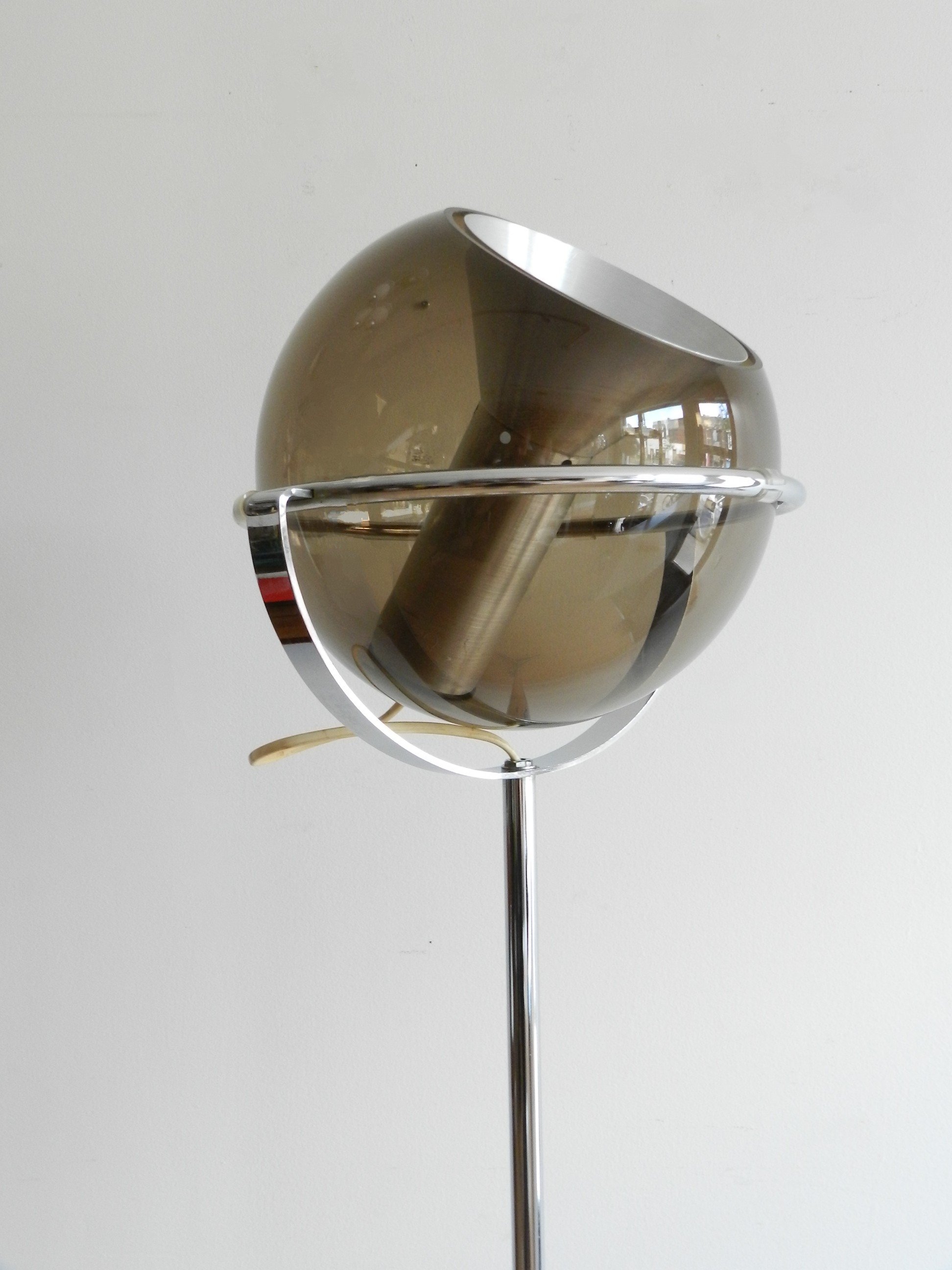 Chrome and glass floor lamp designed by Frank Ligtelijn for Raak.  Netherlands, 1960s.