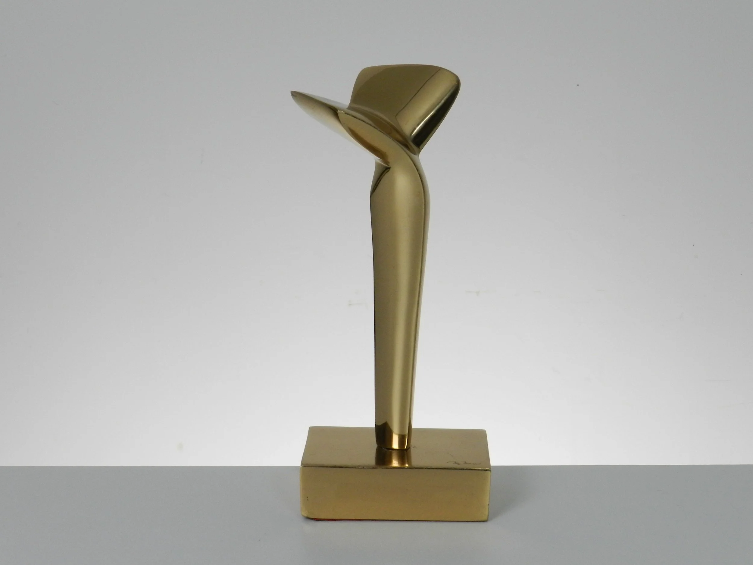 Abstract sculpture in polished bronze by May Marx. Signed on base and leg.  Canada, 1980s.