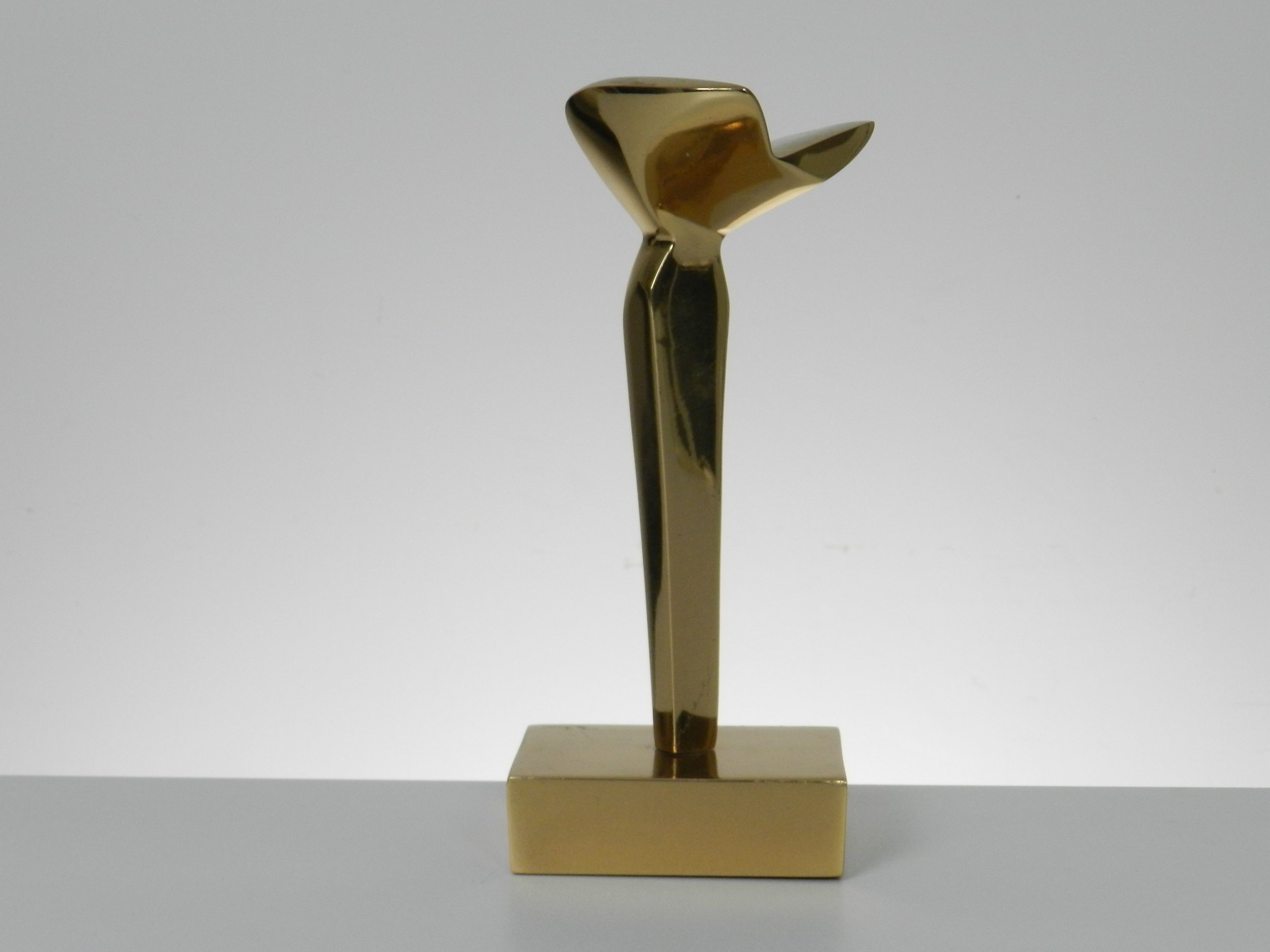 Abstract sculpture in polished bronze by May Marx. Signed on base and leg.  Canada, 1980s.